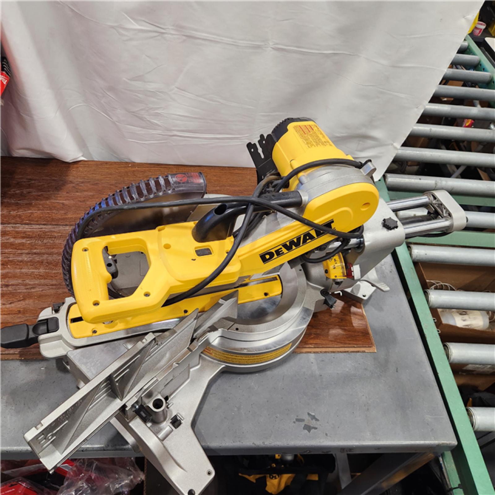 AS-IS DEWALT 15 Amp Corded 12 in. Double Bevel Sliding Compound Miter Saw with XPS Technology, Blade Wrench and Material Clamp