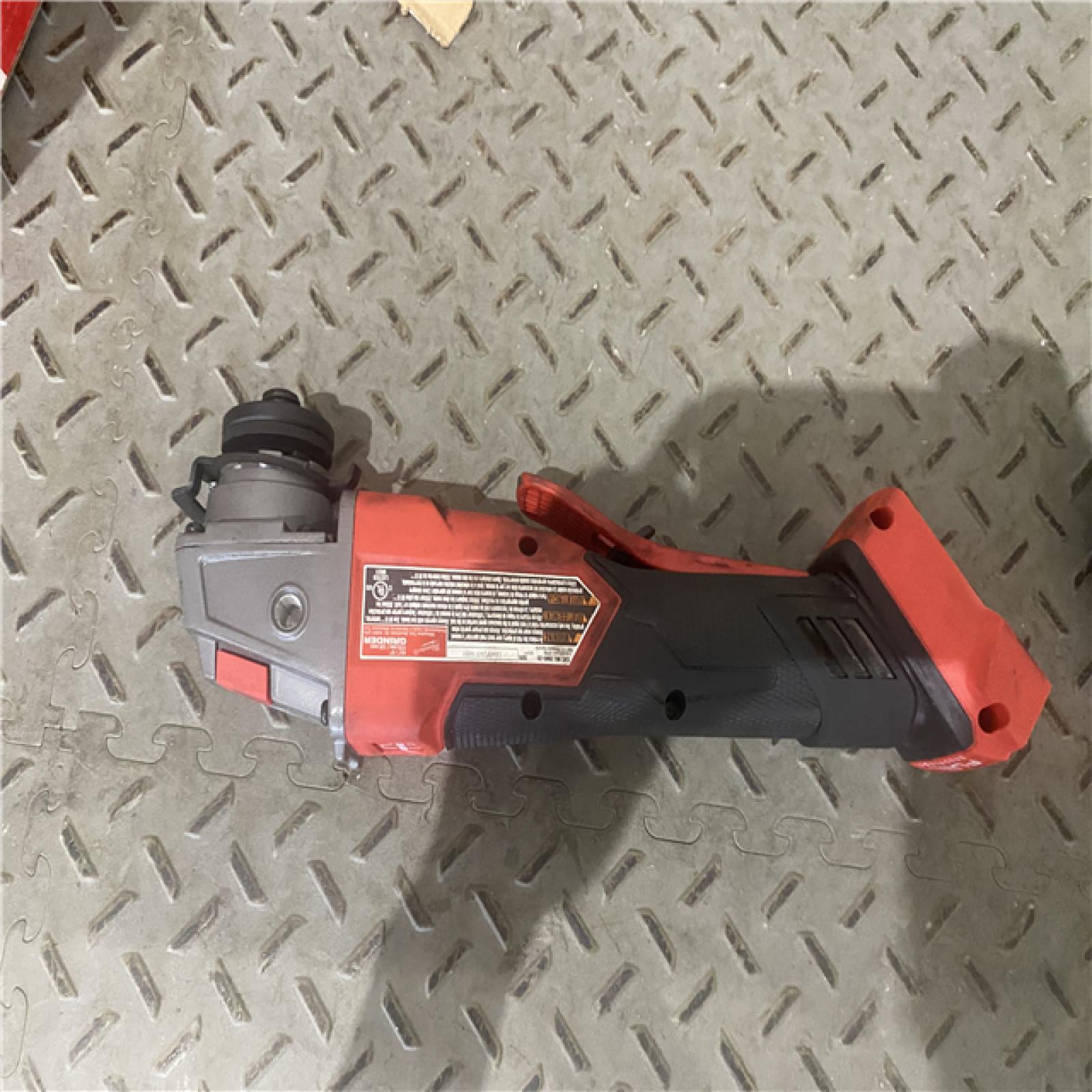 Houston location AS-IS Milwaukee 2880-20 M18 FUEL 18-Volt Lithium-Ion Brushless Cordless 4-1/2 in./5 in. Grinder W/Paddle Switch (Tool-Only)