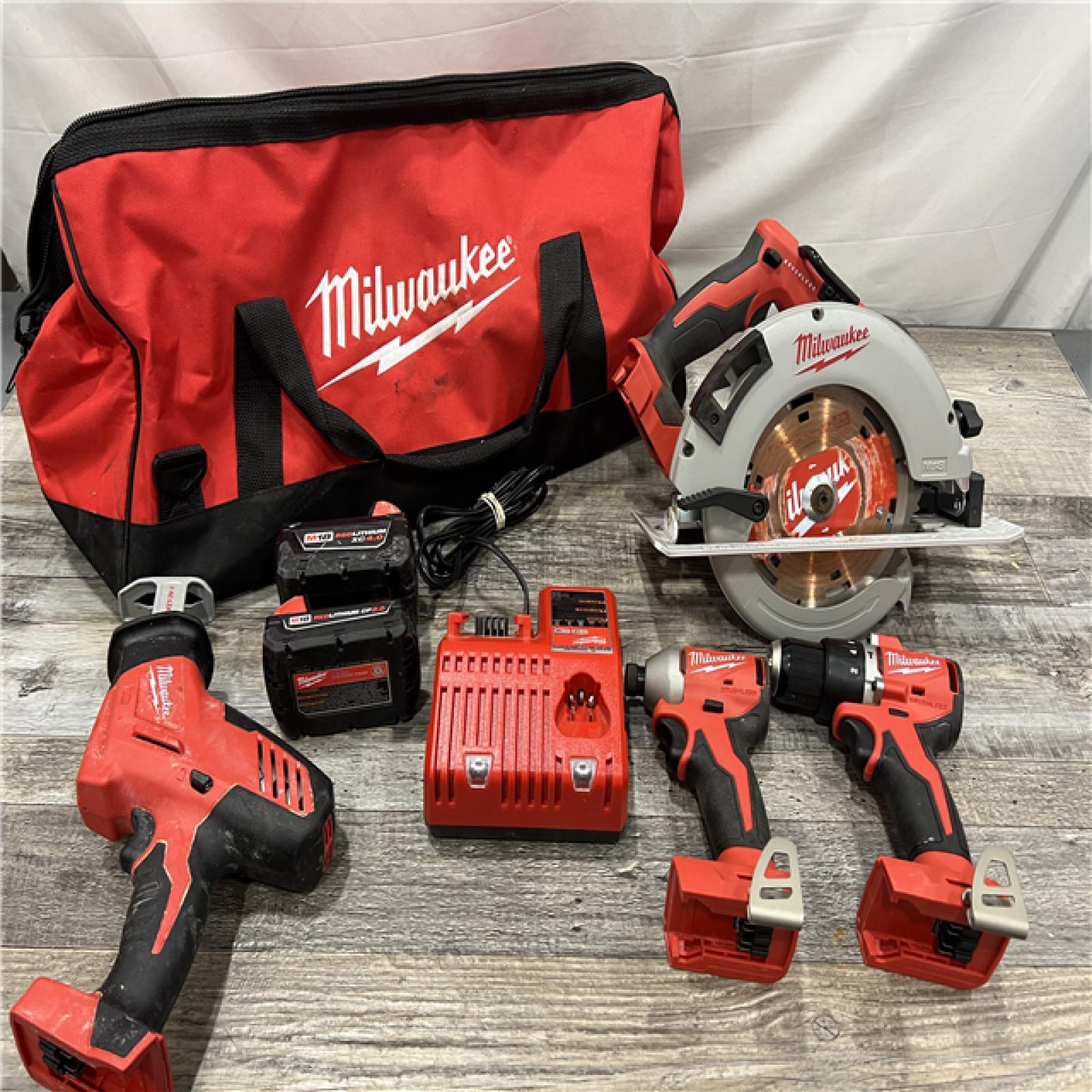 AS-IS MILWAUKEE M18 18-Volt Lithium-Ion Brushless Cordless Combo Kit (4-Tool) with 2-Batteries, 1-Charger and Tool Bag