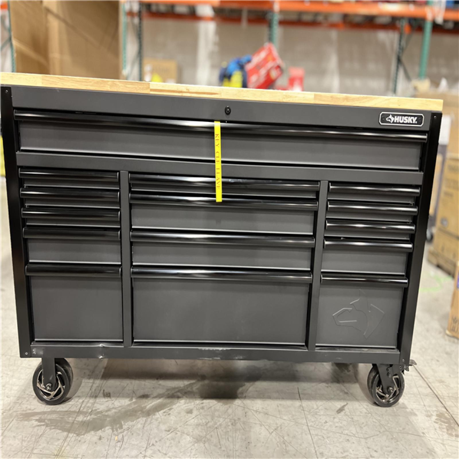 DALLAS LOCATION - Husky 61 in. W x 23 in. D Heavy Duty 15-Drawer Mobile Workbench Tool Chest with Solid Wood Top in Matte Black