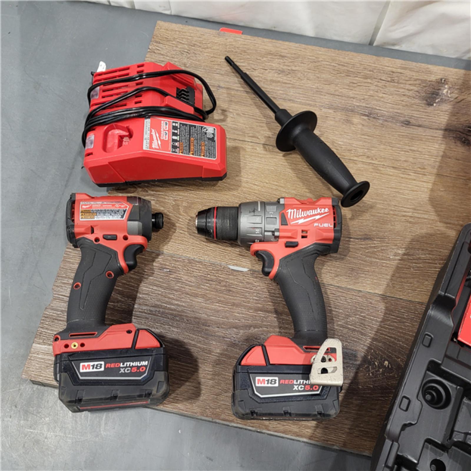 AS-IS Milwaukee M18 FUEL 18V Lithium-Ion Brushless Cordless Hammer Drill and Impact Driver Combo Kit (2-Tool) with 2 Batteries