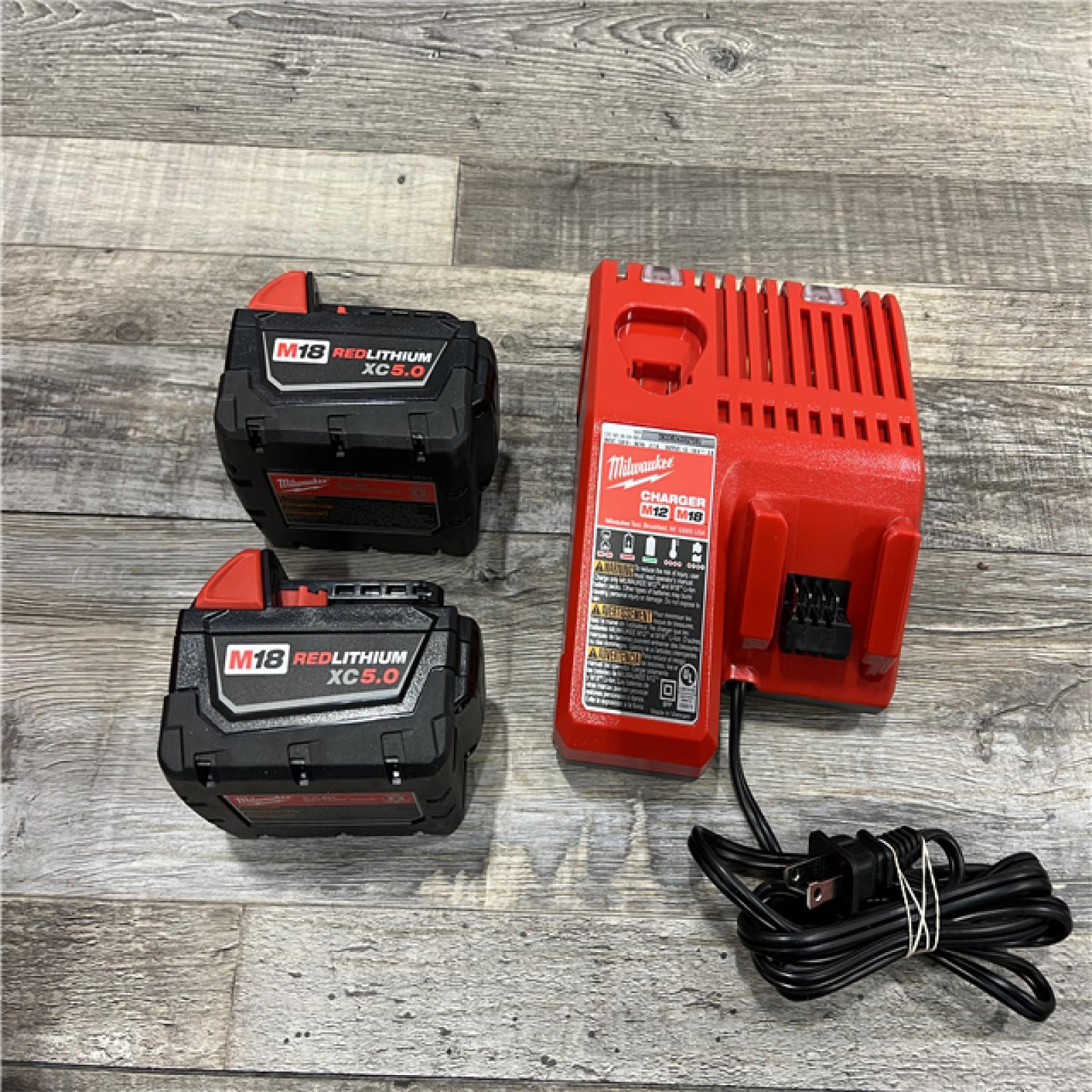 AS-IS Milwaukee M18 18-Volt Lithium-Ion XC Starter Kit with Two 5.0Ah Batteries / Charger (48-59-1852B)