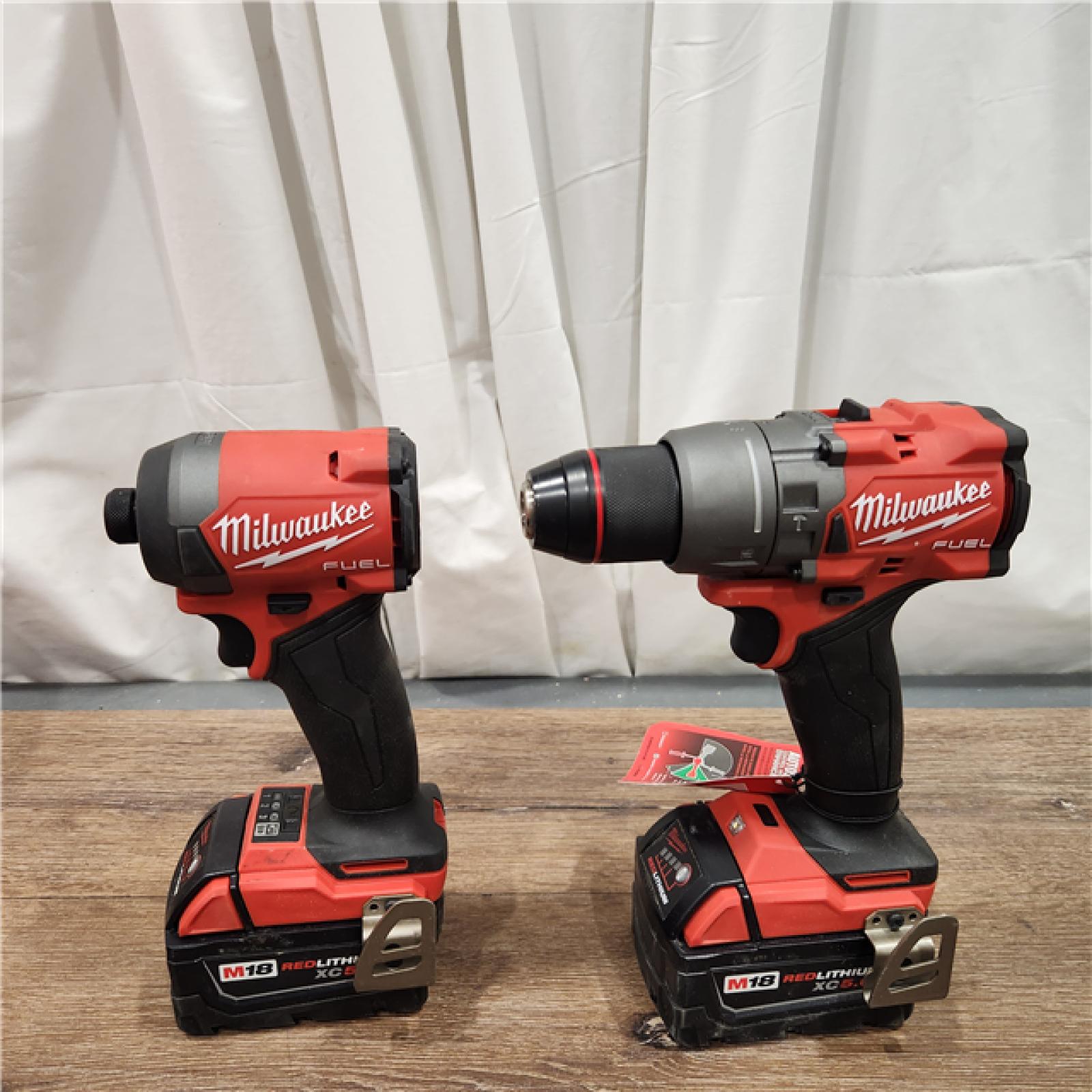 AS-IS Milwaukee M18 FUEL 18V Lithium-Ion Brushless Cordless Hammer Drill and Impact Driver Combo Kit (2-Tool) with 2 Batteries