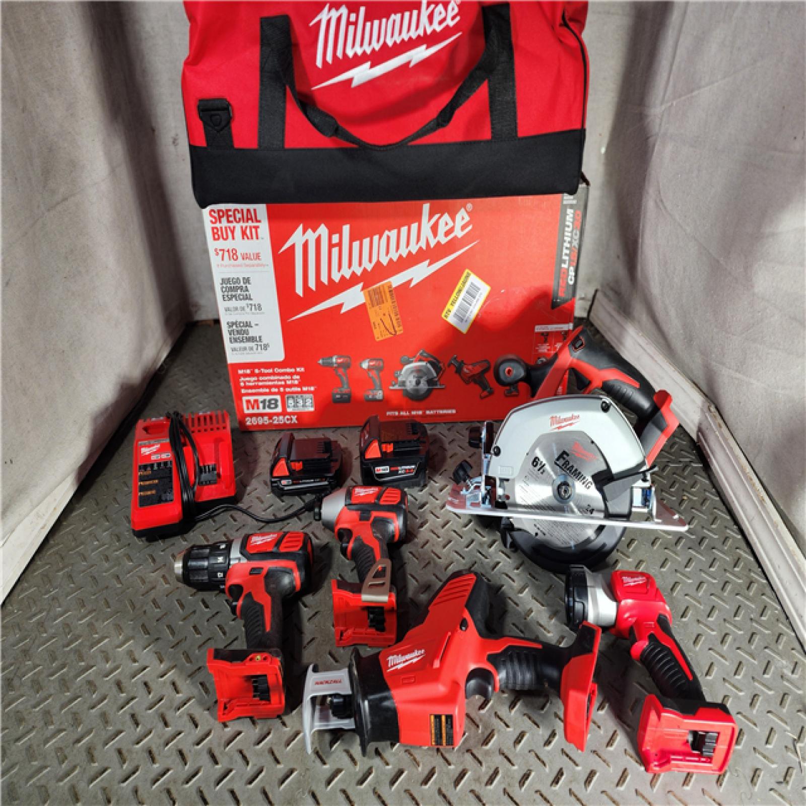 HOUSTON LOCATION - AS-IS Milwaukee M18 18-Volt Lithium-Ion Cordless Combo Tool Kit (5-Tool) with (1) 3.0Ah and (1) 1.5Ah Battery, (1) Charger, (1) Tool Bag