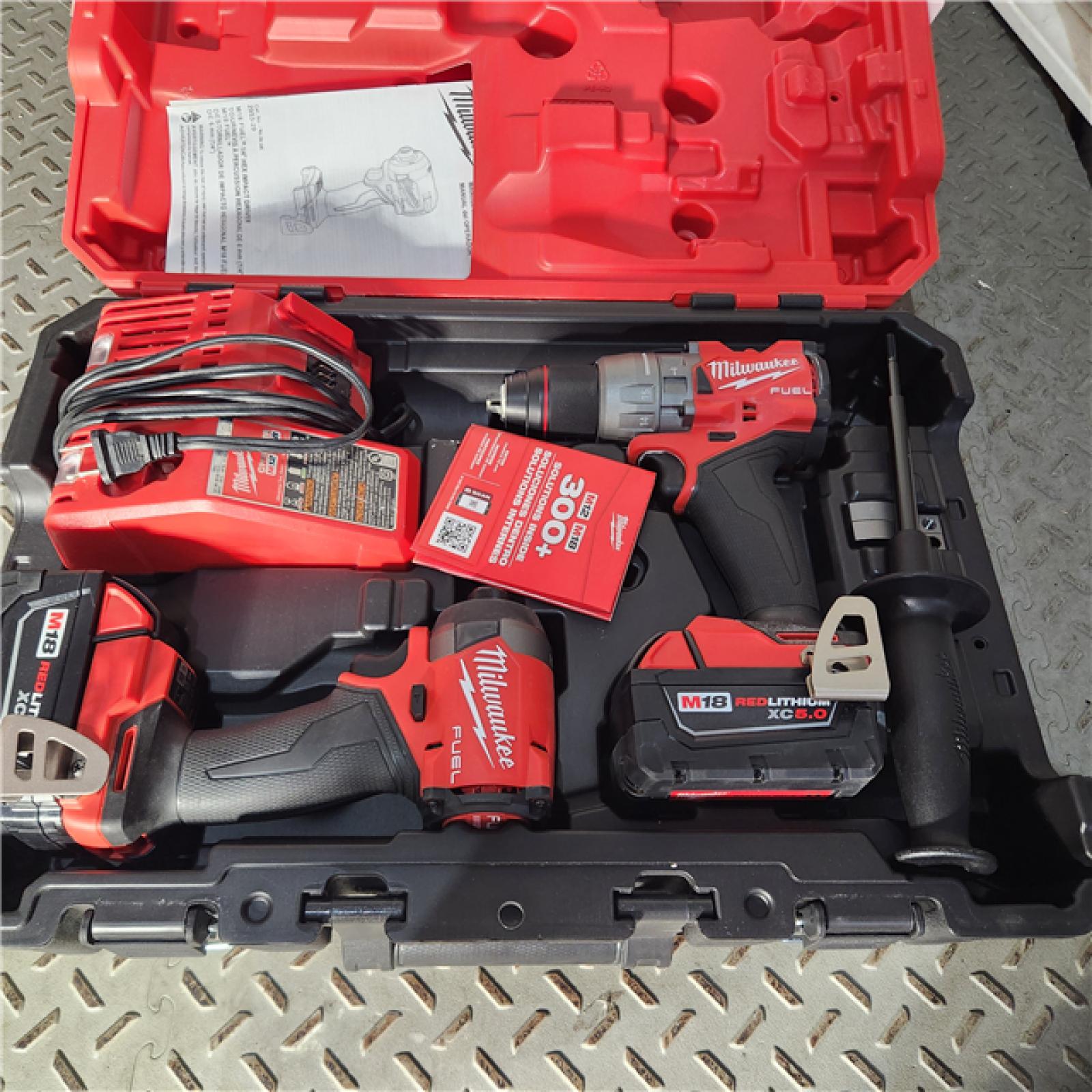 Houston location AS-IS Milwaukee 3697-22 M18 FUEL 1/2 Hammer Driller/Driver &1/4 Hex Impact Driver 2 Tool Combo Kit