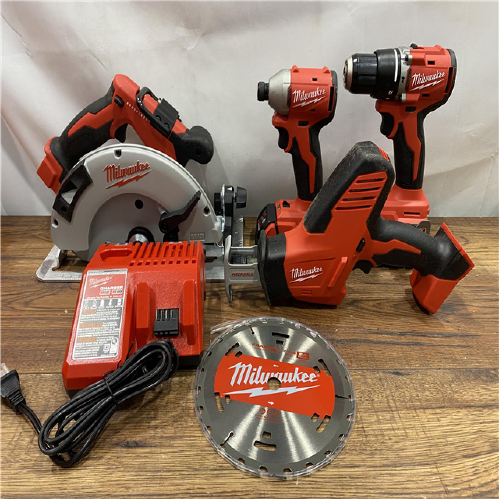 AS IS Milwaukee M18 18-Volt Lithium-Ion Brushless Cordless Combo Kit (4-Tool) with 2-Batteries, 1-Charger and Tool Bag