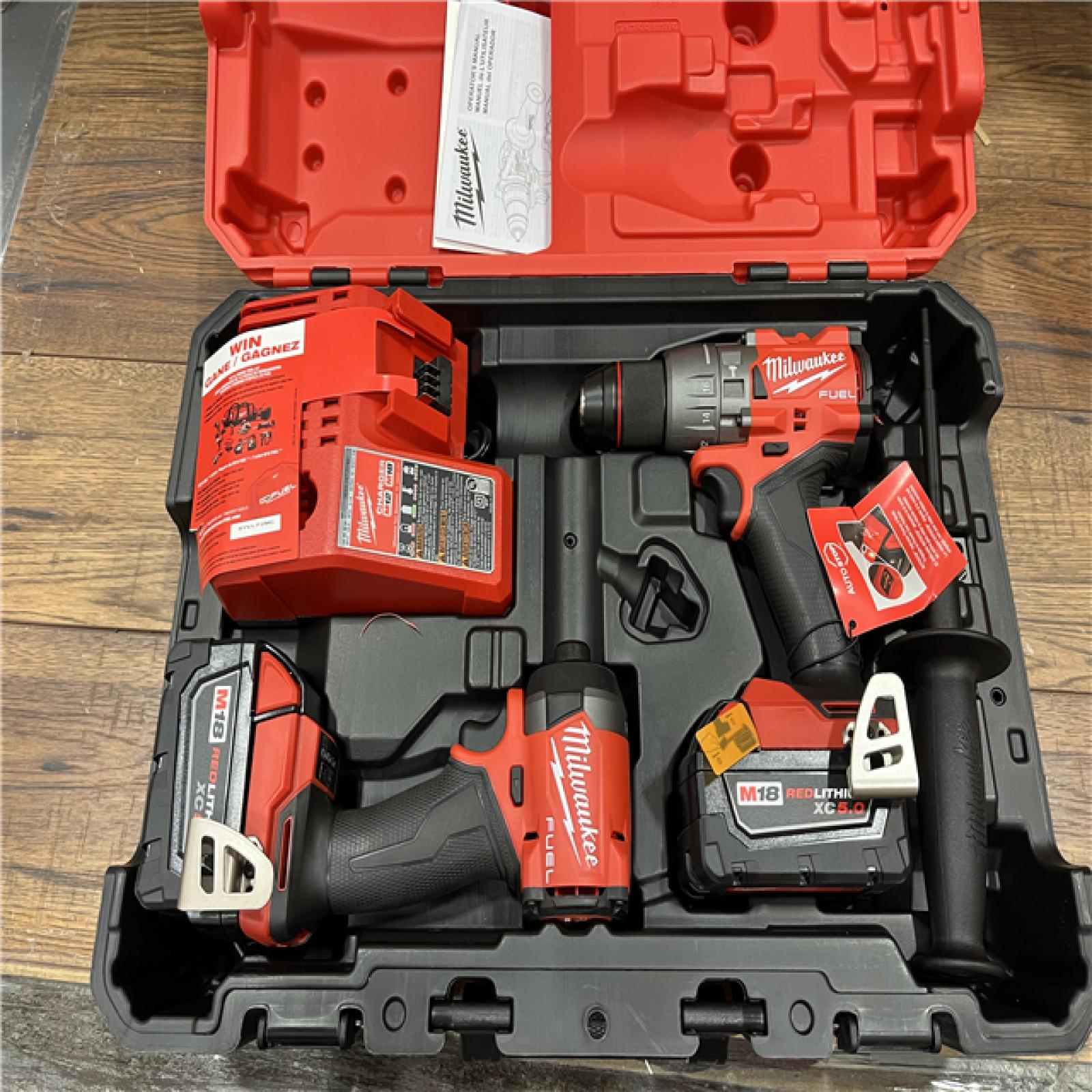 AS-IS Milwaukee M18 FUEL 18V Lithium-Ion Brushless Cordless Hammer Drill and Impact Driver Combo Kit (2-Tool) with 2 Batteries