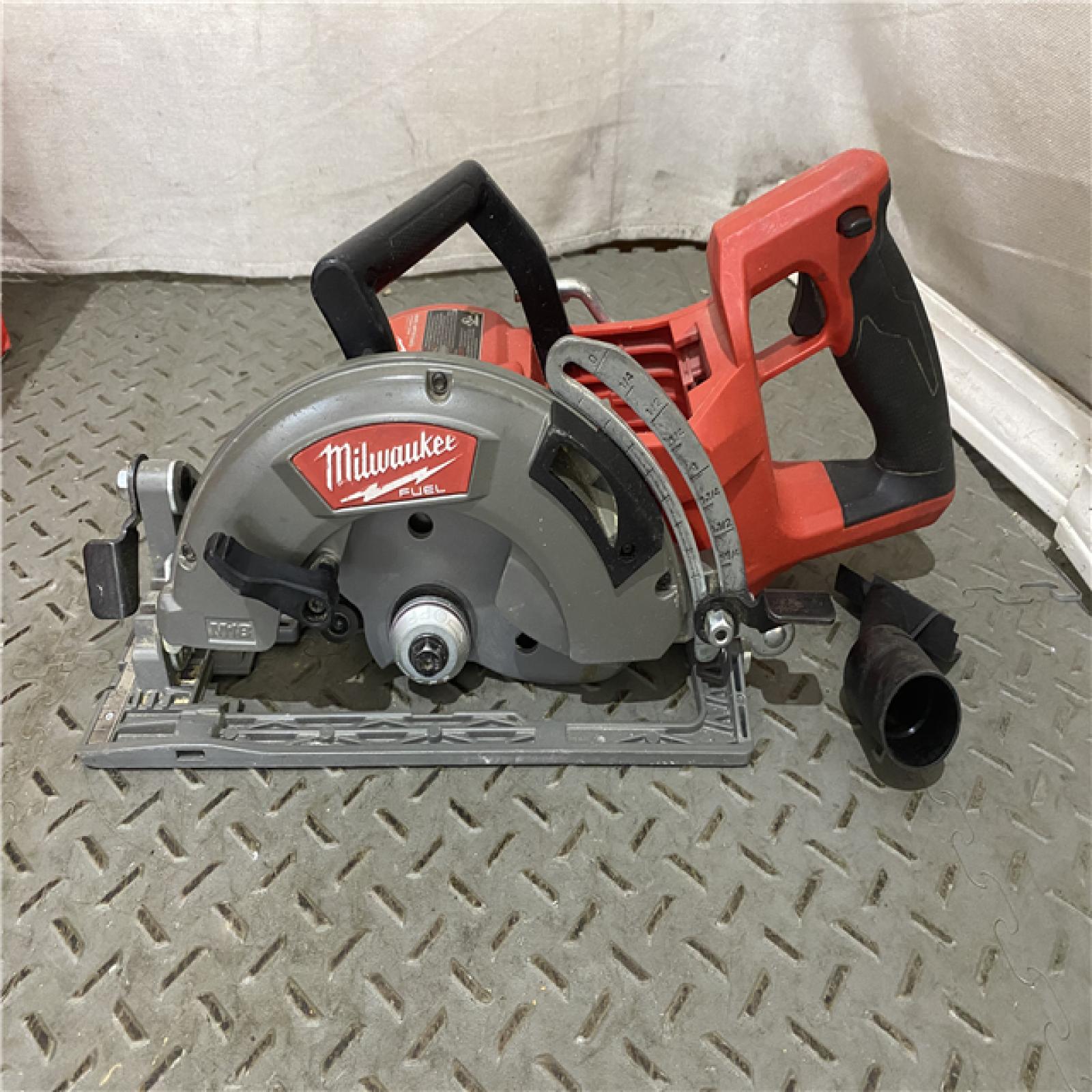 Houston location AS-IS  Milwaukee 2830-20 Rear Handle Circular Saw M18 FUEL 7-1/4  Cordless Brushless Tool Only