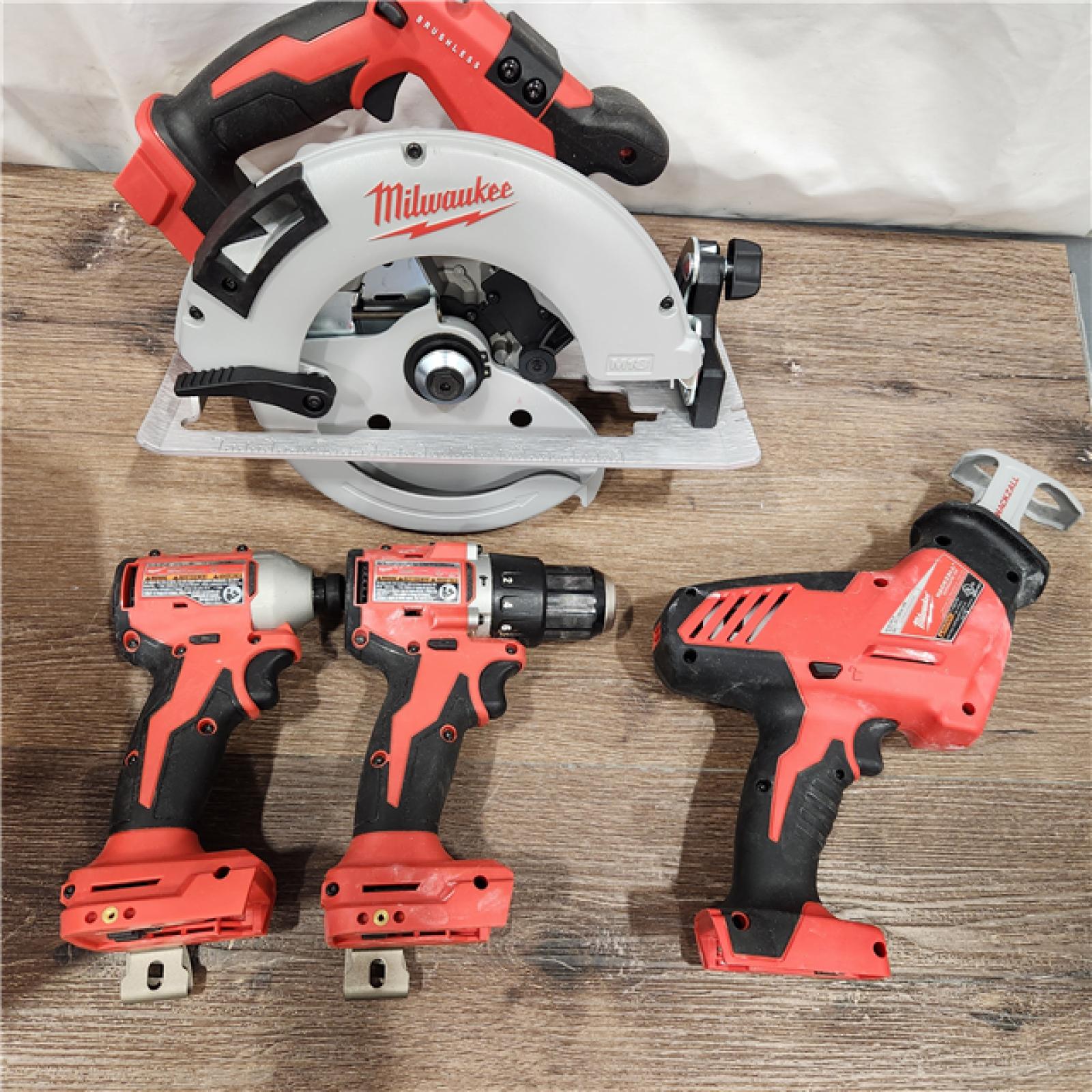 AS-IS Milwaukee M18 18-Volt Lithium-Ion Brushless Cordless Combo Kit (4-Tool) with 2-Batteries, 1-Charger and Tool Bag