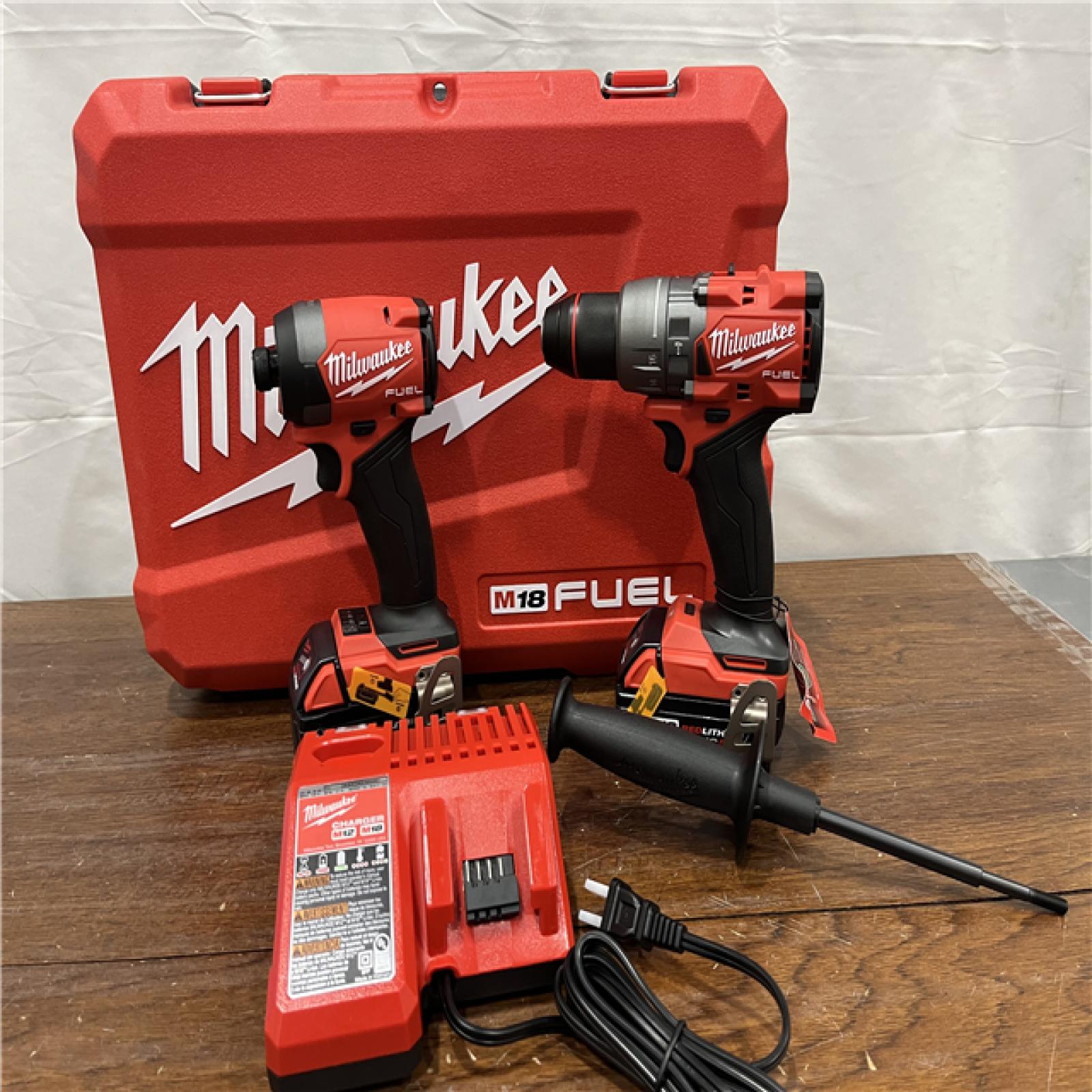 AS-IS Milwaukee M18 FUEL 18V Lithium-Ion Brushless Cordless Hammer Drill and Impact Driver Combo Kit (2-Tool) with 2 Batteries