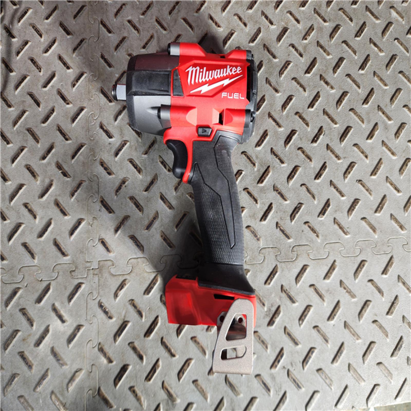 HOUSTON LOCATION - AS-IS (APPEARS LIKE NEW) Milwaukee M18 FUEL 1/2Inch Mid-Torque Impact Wrench with Friction Ring Kit - Two 5.0Ah Batteries, Model 2962-22