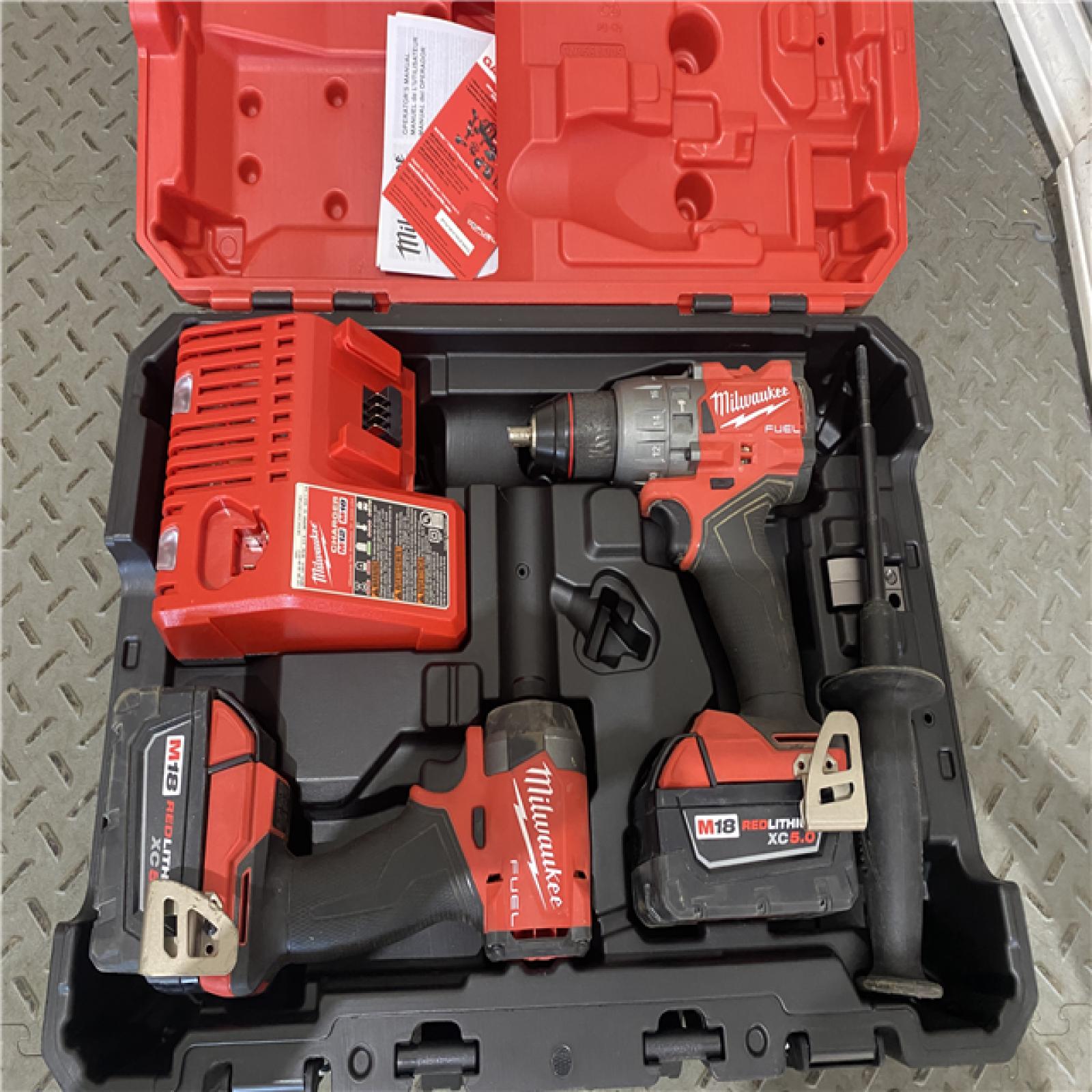 Houston location AS-IS Milwaukee 3697-22 M18 FUEL 1/2 Hammer Driller/Driver &1/4 Hex Impact Driver 2 Tool Combo Kit