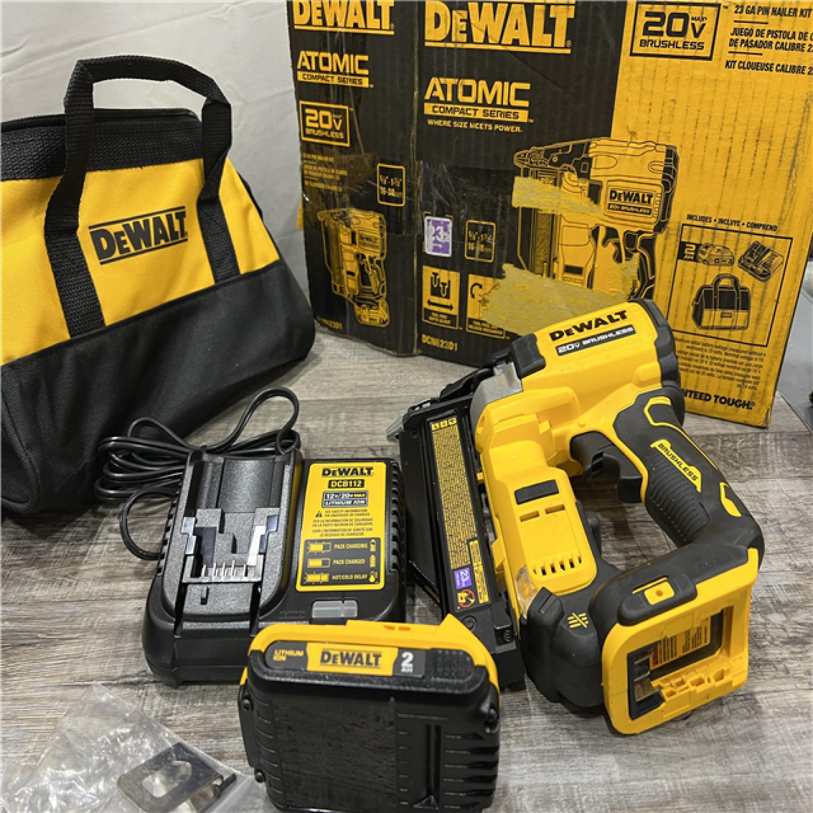 AS-IS DEWALT ATOMIC 20V MAX Lithium Ion Cordless 23 Gauge Pin Nailer Kit with 2.0Ah Battery and Charger