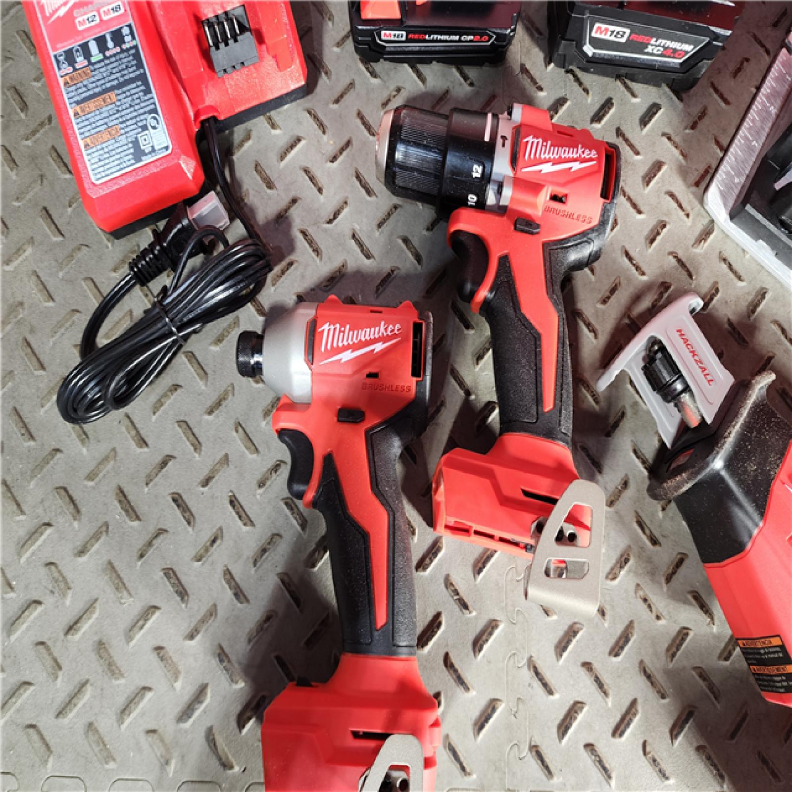 HOUSTON LOCATION - AS-IS (APPEARS LIKE NEW) Milwaukee M18 18-Volt Lithium-Ion Brushless Cordless Combo Kit (4-Tool) with 2-Batteries, 1-Charger and Tool Bag