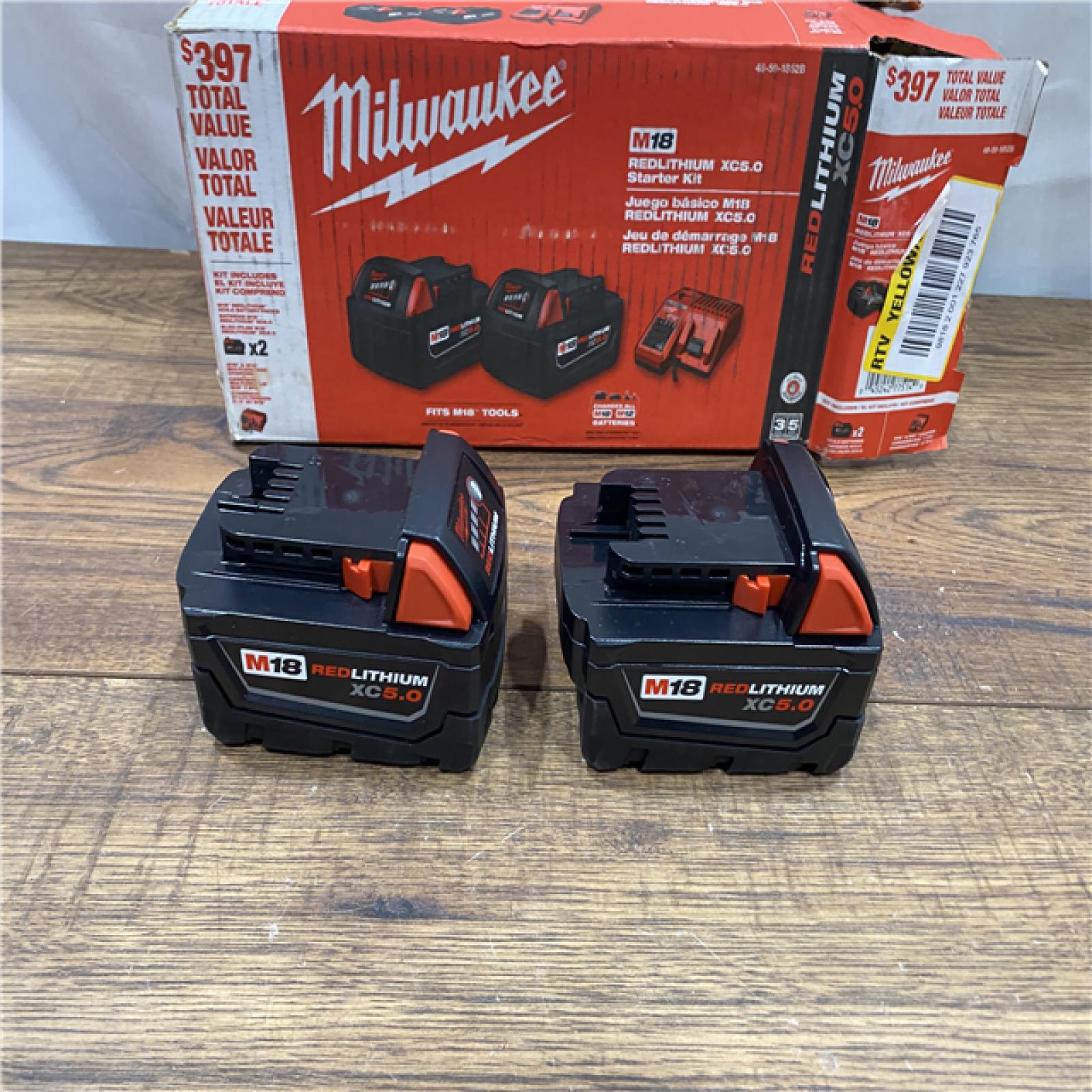 AS IS Milwaukee M18 18-Volt Lithium-Ion XC Starter Kit with Two 5.0Ah Batteries / Charger (48-59-1852B)