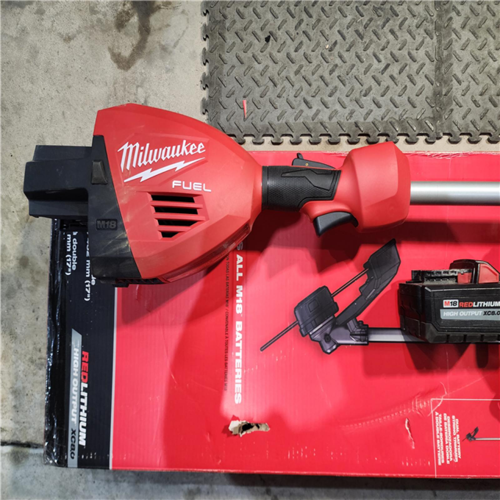 HOUSTON LOCATION - AS-IS (APPEARS LIKE NEW) Milwaukee M18 FUEL 18V Brushless Cordless 17 in. Dual Battery Straight Shaft String Trimmer Kit