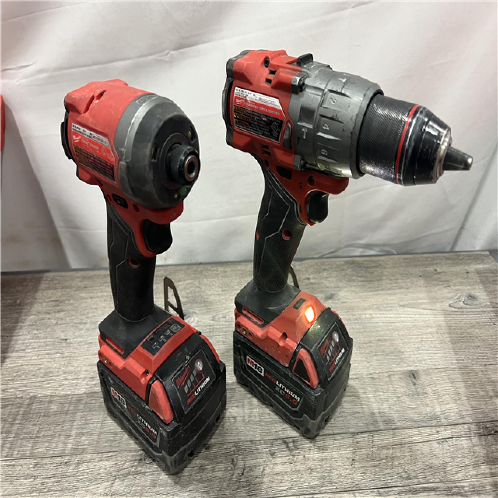 AS-IS MILWAUKEE M18 FUEL 18V Lithium-Ion Brushless Cordless Hammer Drill and Impact Driver Combo Kit (2-Tool) with 2 Batteries