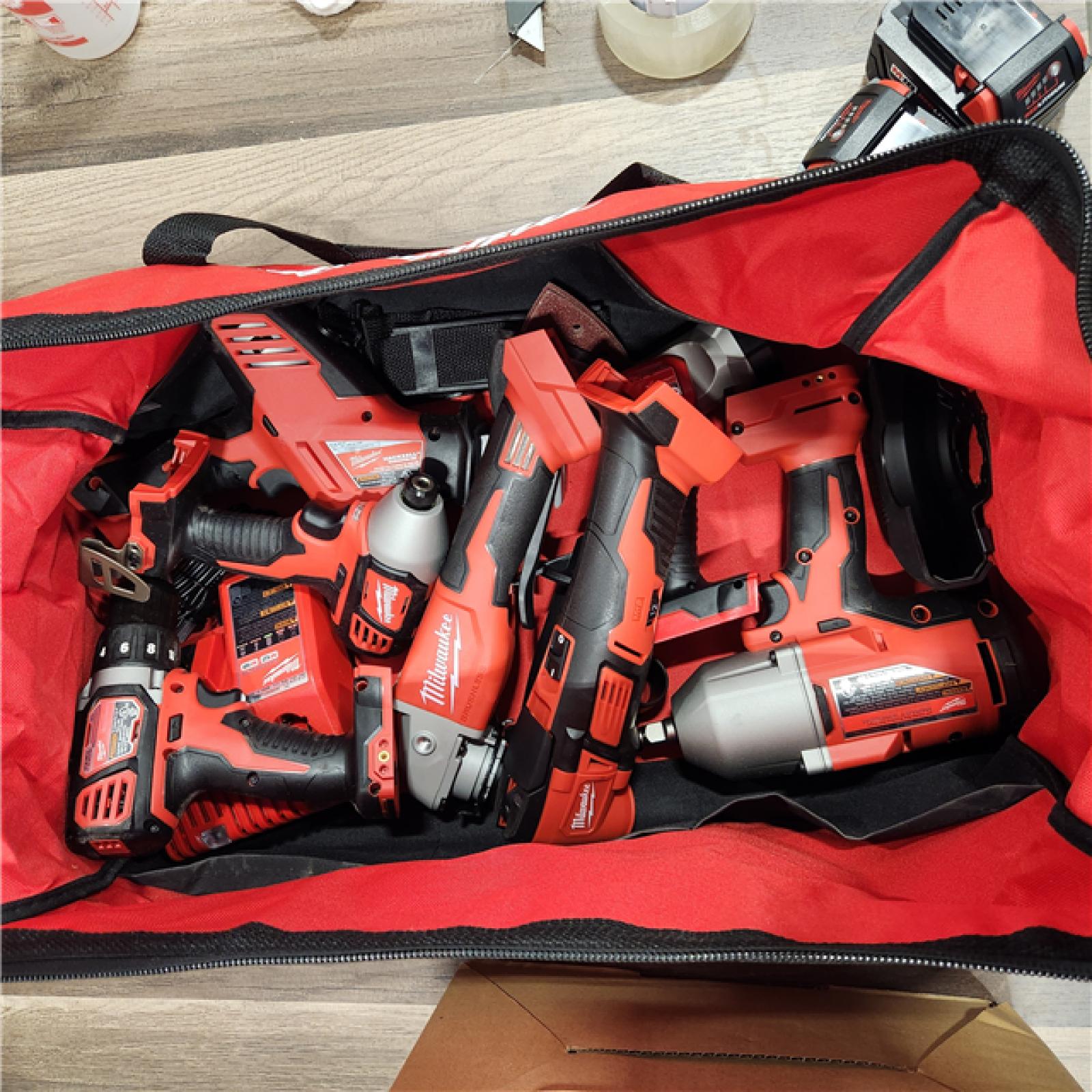 AS IS Milwaukee M18 18-Volt Lithium-Ion Cordless Combo Kit (9-Tool) with (2) Batteries, Charger, and Tool Bag