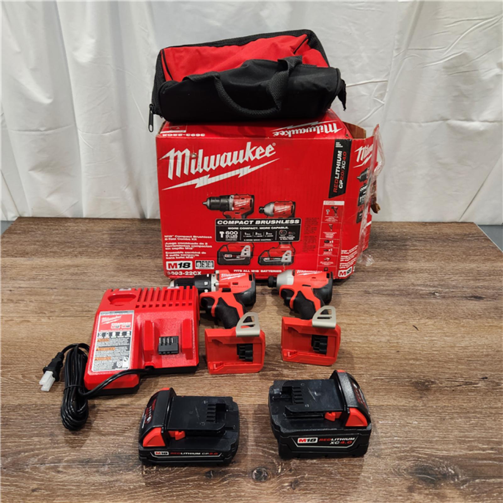 AS-IS M18 18-Volt Lithium-Ion Brushless Cordless Compact Hammer Drill/Impact Combo Kit (2-Tool) with (2) Batteries, Bag