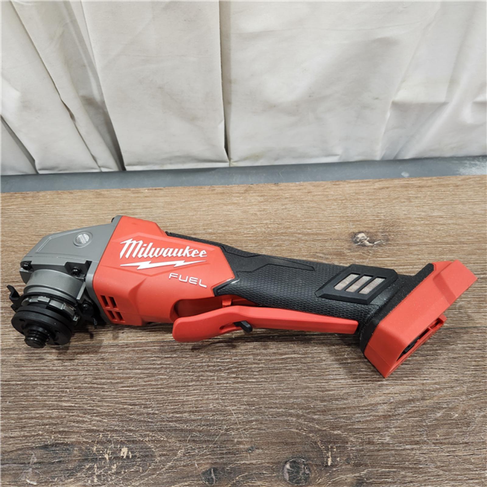 AS-IS M18 FUEL 18V Lithium-Ion Brushless Cordless 4-1/2 in./5 in. Grinder with Variable Speed & Paddle Switch (Tool-Only)