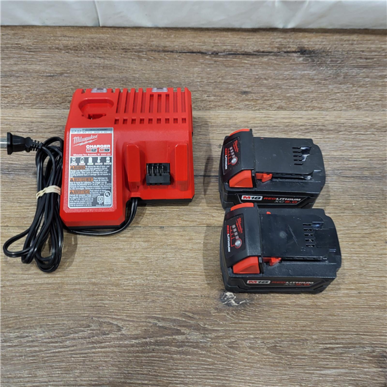 AS-IS Milwaukee M18 18-Volt Lithium-Ion XC Starter Kit with Two 5.0Ah Batteries / Charger (48-59-1852B)