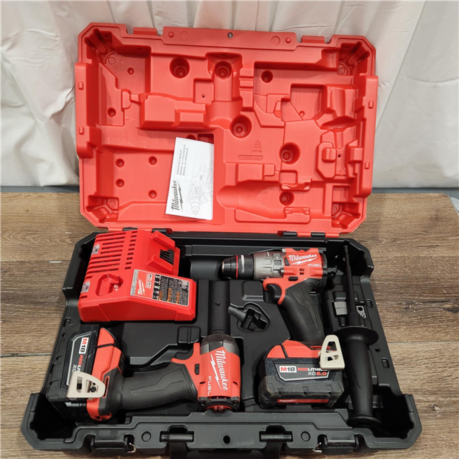 AS-IS Milwaukee M18 FUEL 18V Lithium-Ion Brushless Cordless Hammer Drill and Impact Driver Combo Kit (2-Tool) with 2 Batteries