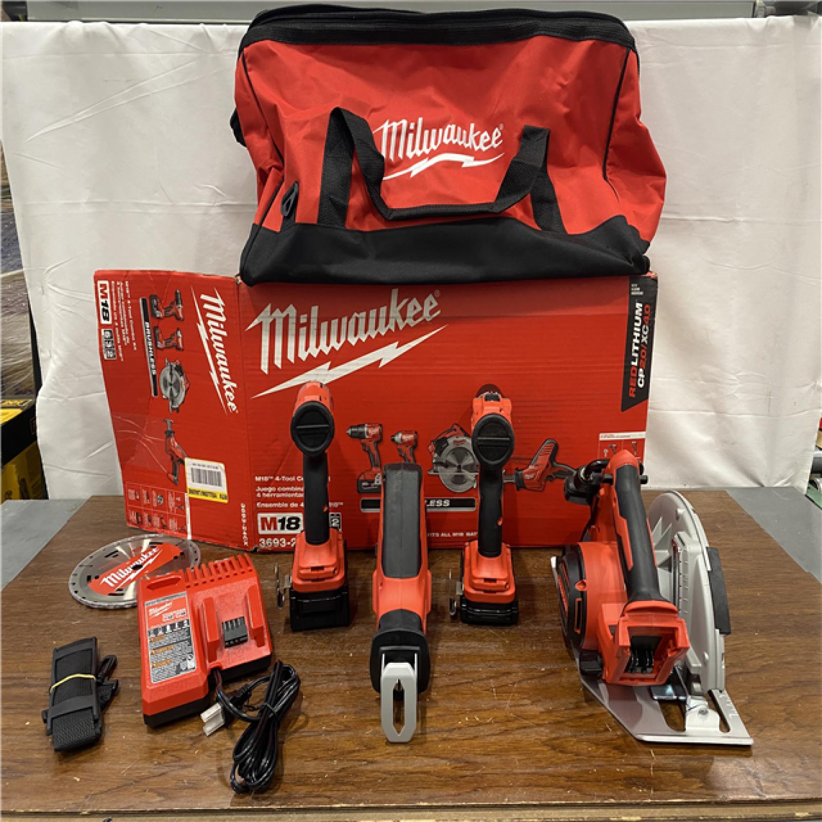 AS-IS Milwaukee M18 18-Volt Lithium-Ion Brushless Cordless Combo Kit (4-Tool) with 2-Batteries, 1-Charger and Tool Bag