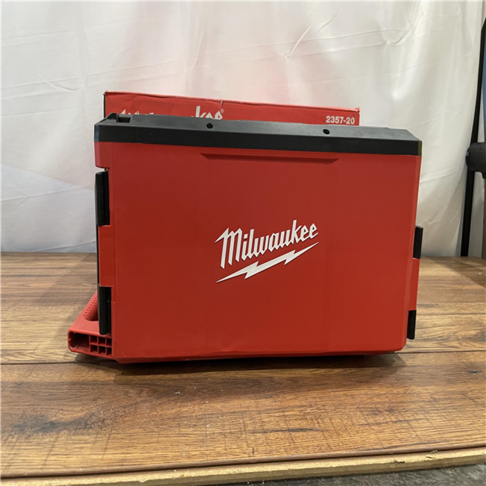 AS-IS Milwaukee  M18 PACKOUT Cordless Lithium-Ion Light/Charger (Tool Only)