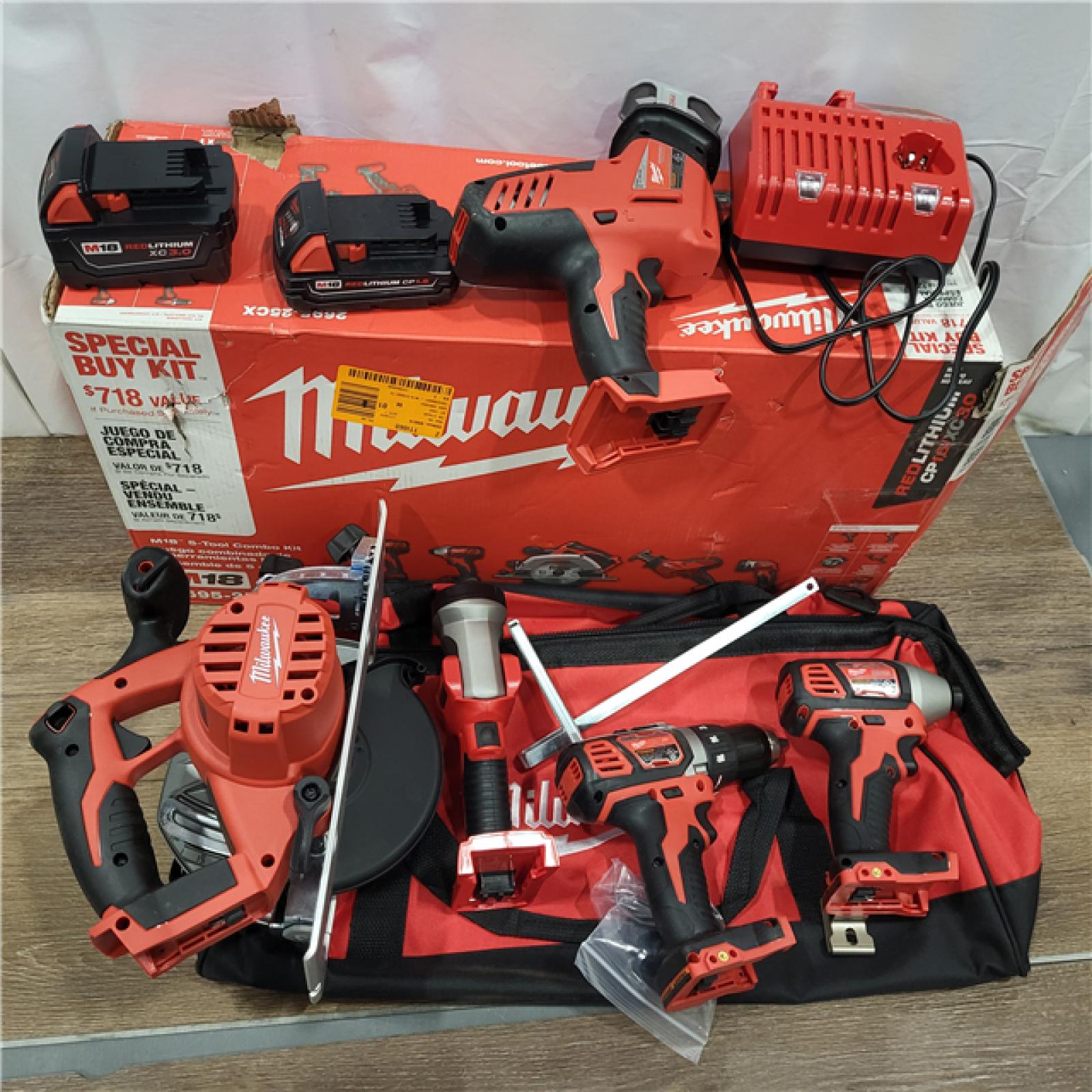 AS-IS Milwaukee M18 18-Volt Lithium-Ion Cordless Combo Tool Kit (5-Tool) with (1) 3.0Ah and (1) 1.5Ah Battery, (1) Charger, (1) Tool Bag