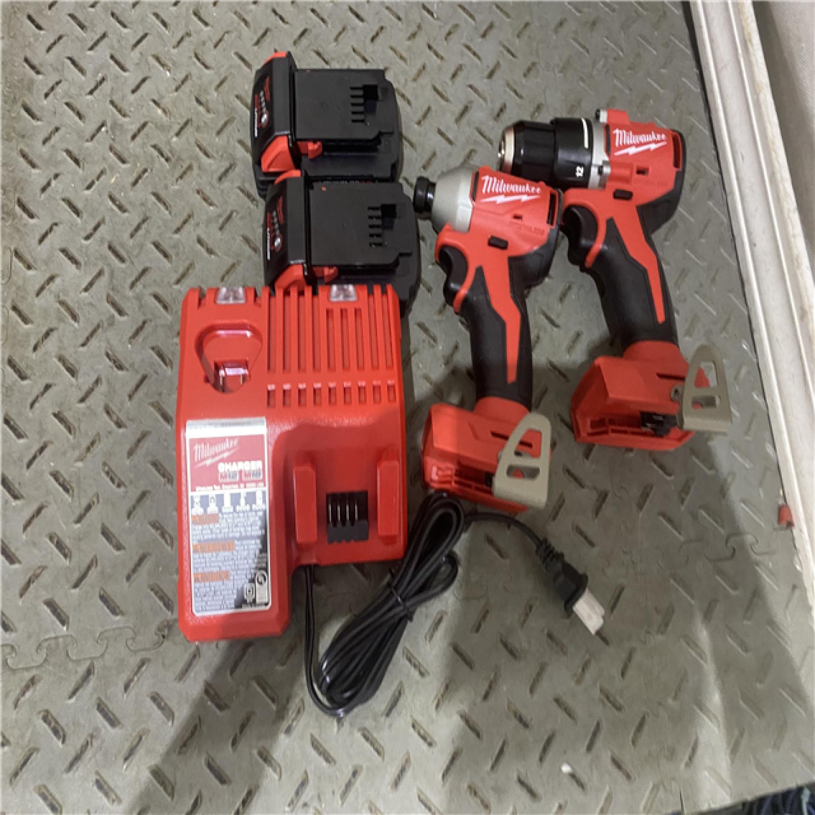 Houston location AS-IS Milwuakee M18 18V Lithium-Ion Brushless Cordless Compact Drill/Impact Combo Kit (2-Tool) W/(2) 2.0 Ah Batteries, Charger & Bag