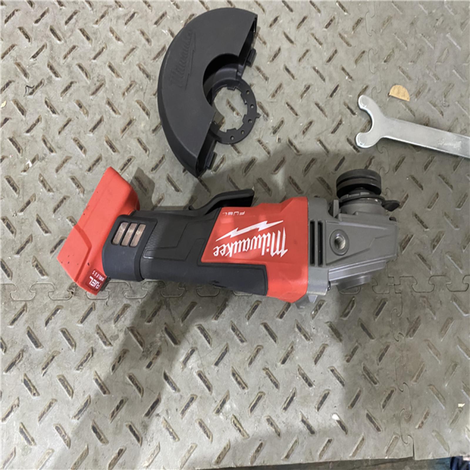 Houston location AS-IS Milwaukee 2880-20 M18 FUEL 18-Volt Lithium-Ion Brushless Cordless 4-1/2 in./5 in. Grinder W/Paddle Switch (Tool-Only)