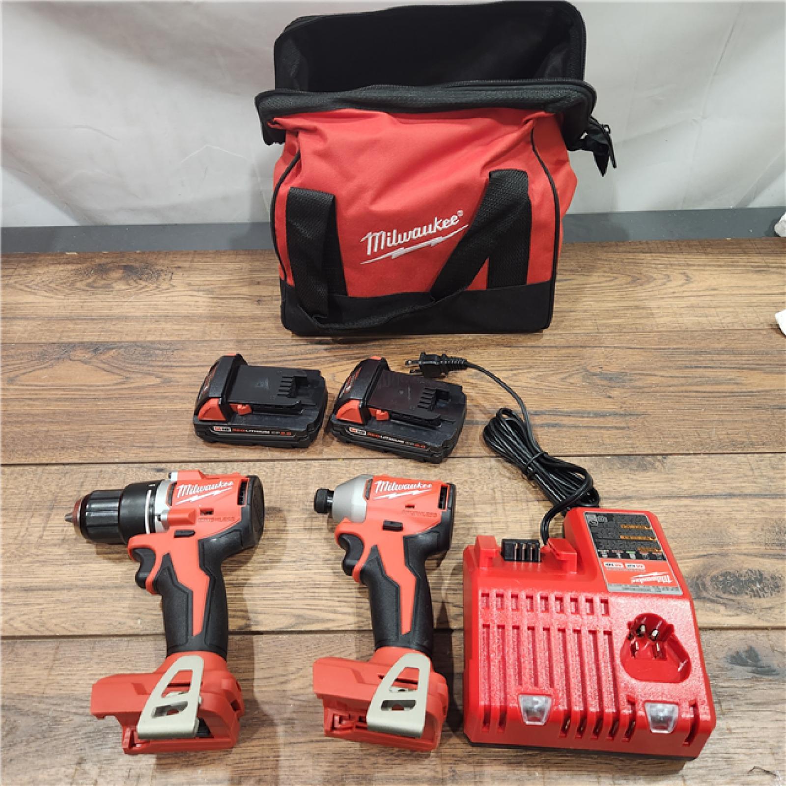 AS-IS M18 18-Volt Lithium-Ion Brushless Cordless Compact Hammer Drill/Impact Combo Kit (2-Tool) with (2) Batteries, Bag