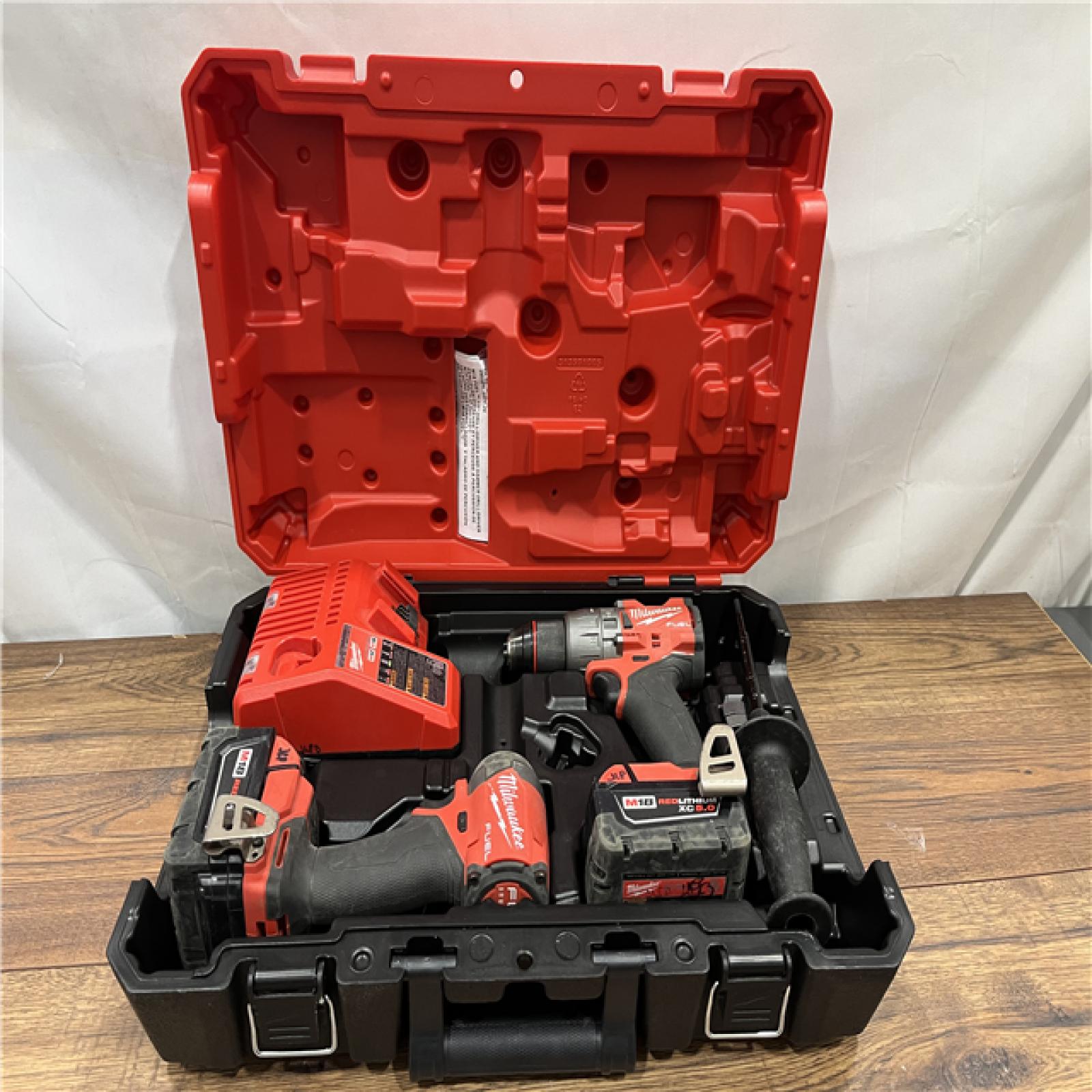 AS-IS Milwaukee M18 FUEL 18V Lithium-Ion Brushless Cordless Hammer Drill and Impact Driver Combo Kit (2-Tool) with 2 Batteries