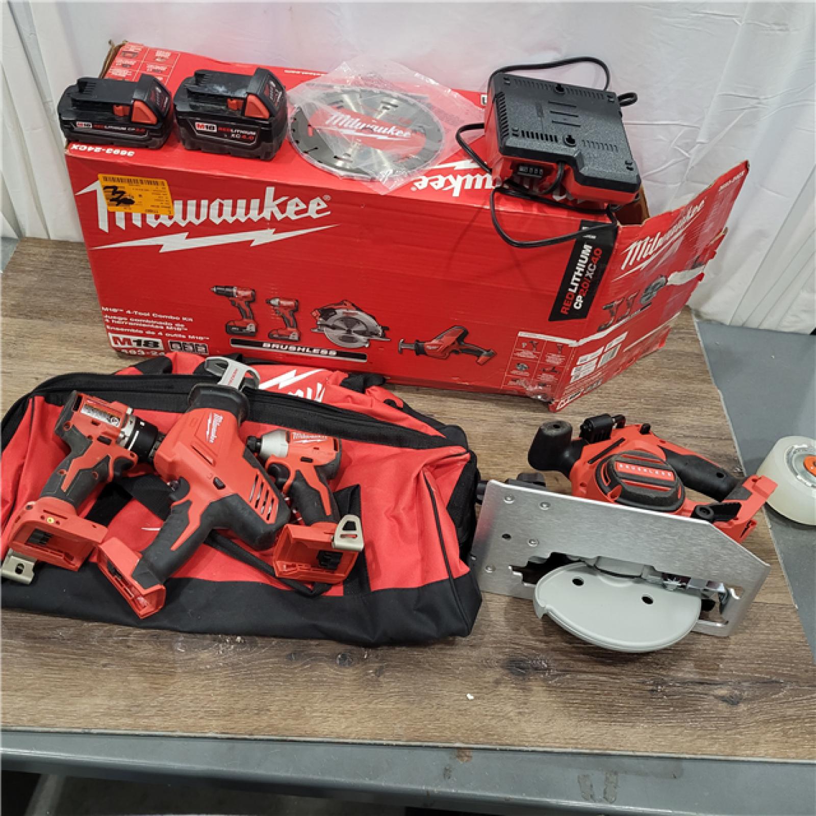 AS-IS Milwaukee M18 18-Volt Lithium-Ion Brushless Cordless Combo Kit (4-Tool) with 2-Batteries, 1-Charger and Tool Bag