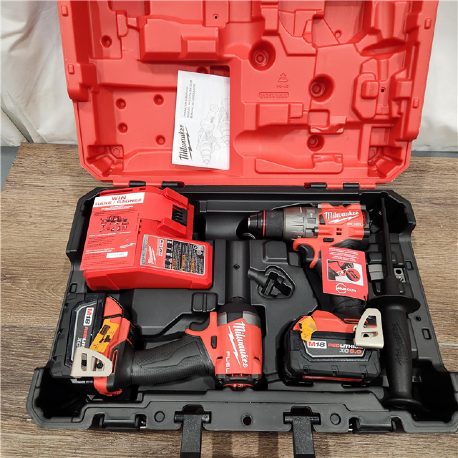 AS-IS Milwaukee M18 FUEL 18V Lithium-Ion Brushless Cordless Hammer Drill and Impact Driver Combo Kit (2-Tool) with 2 Batteries