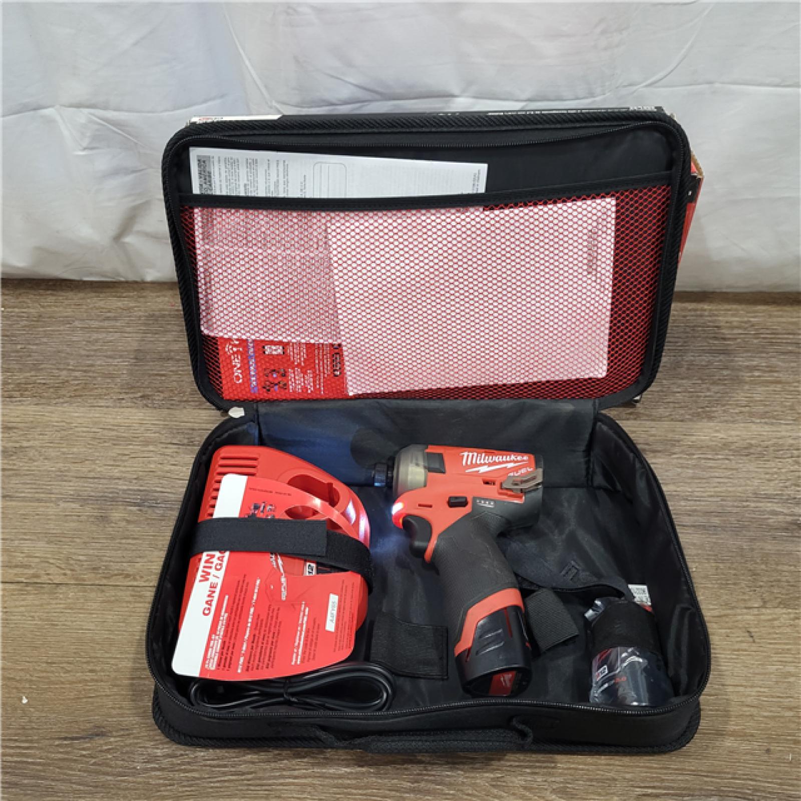 AS-IS M12 FUEL SURGE 12V Lithium-Ion Brushless Cordless 1/4 in. Hex Impact Driver Compact Kit W/Two 2.0Ah Batteries, Bag