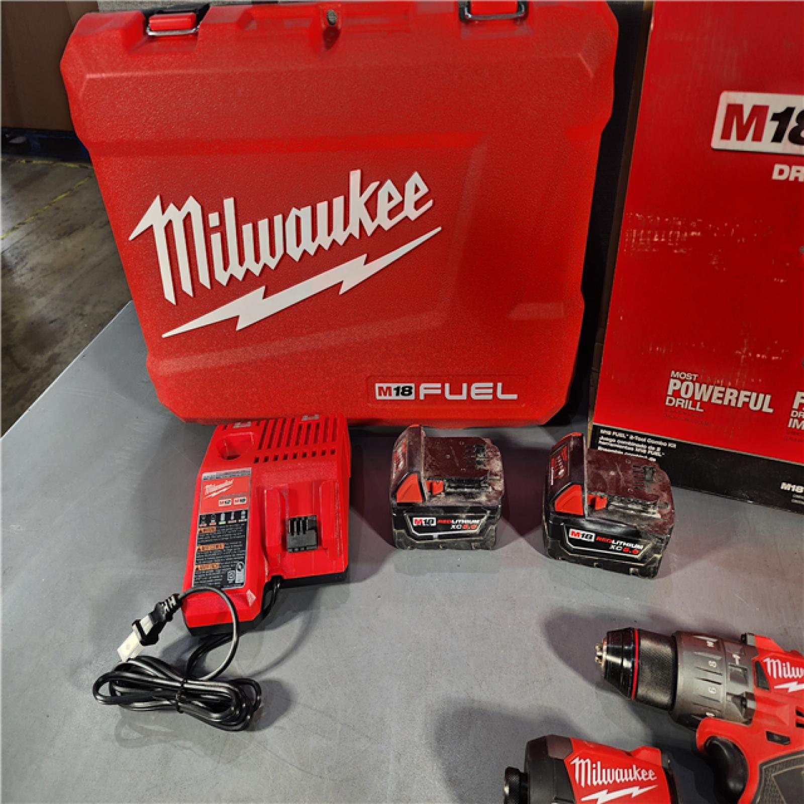 HOUSTON LOCATION - AS-IS Milwaukee M18 FUEL 18V Lithium-Ion Brushless Cordless Hammer Drill and Impact Driver Combo Kit (2-Tool) with 2 Batteries