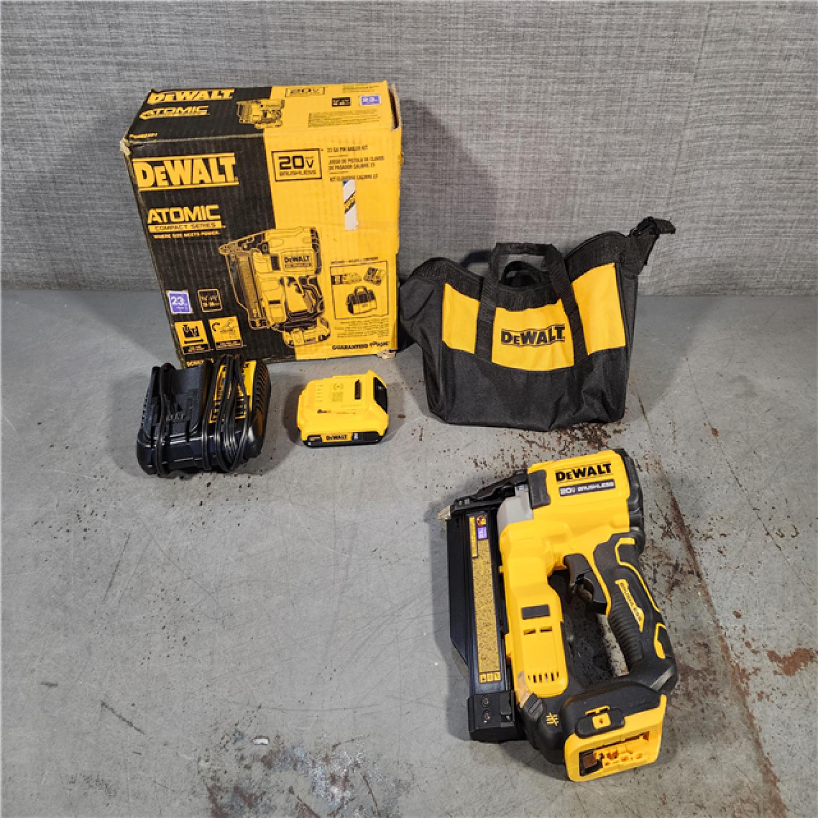 HOUSTON LOCATION - AS-IS DEWALT ATOMIC 20V MAX Lithium Ion Cordless 23 Gauge Pin Nailer Kit with 2.0Ah Battery and Charger