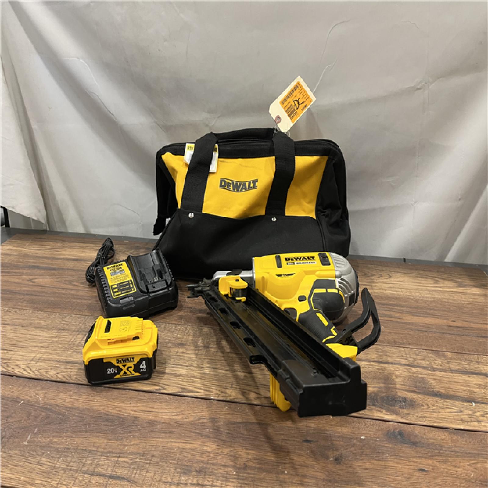 AS-IS DEWALT 20V MAX* 21 Degree Plastic Collated Cordless Framing Nailer with Two 4Ah Lithium Ion Batteries, Charger, and Kit Bag