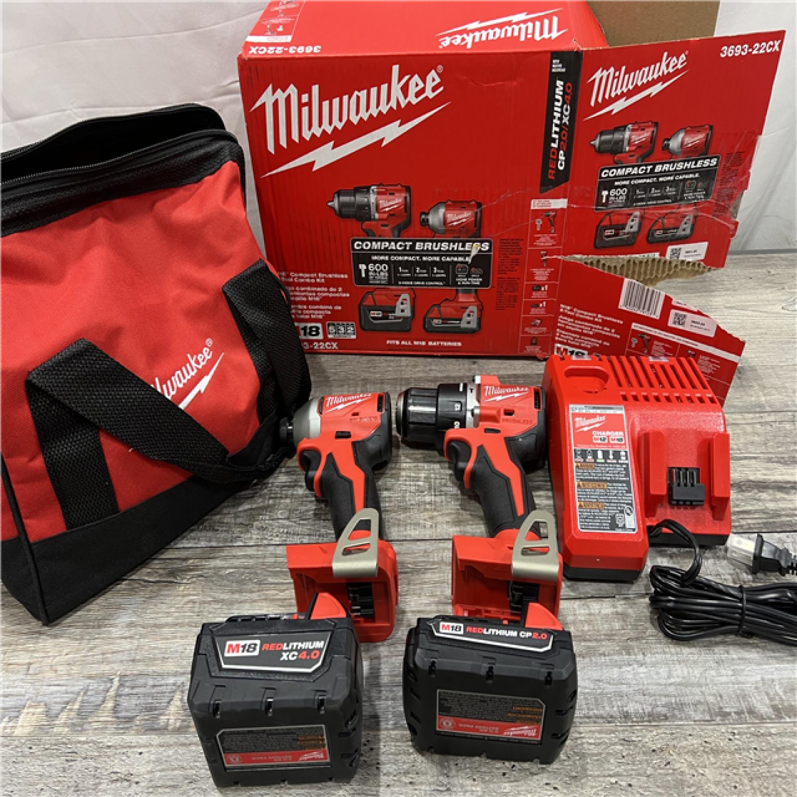 AS-IS MILWAUKEE M18 18-Volt Lithium-Ion Brushless Cordless Compact Hammer Drill/Impact Combo Kit (2-Tool) with (2) Batteries, Bag