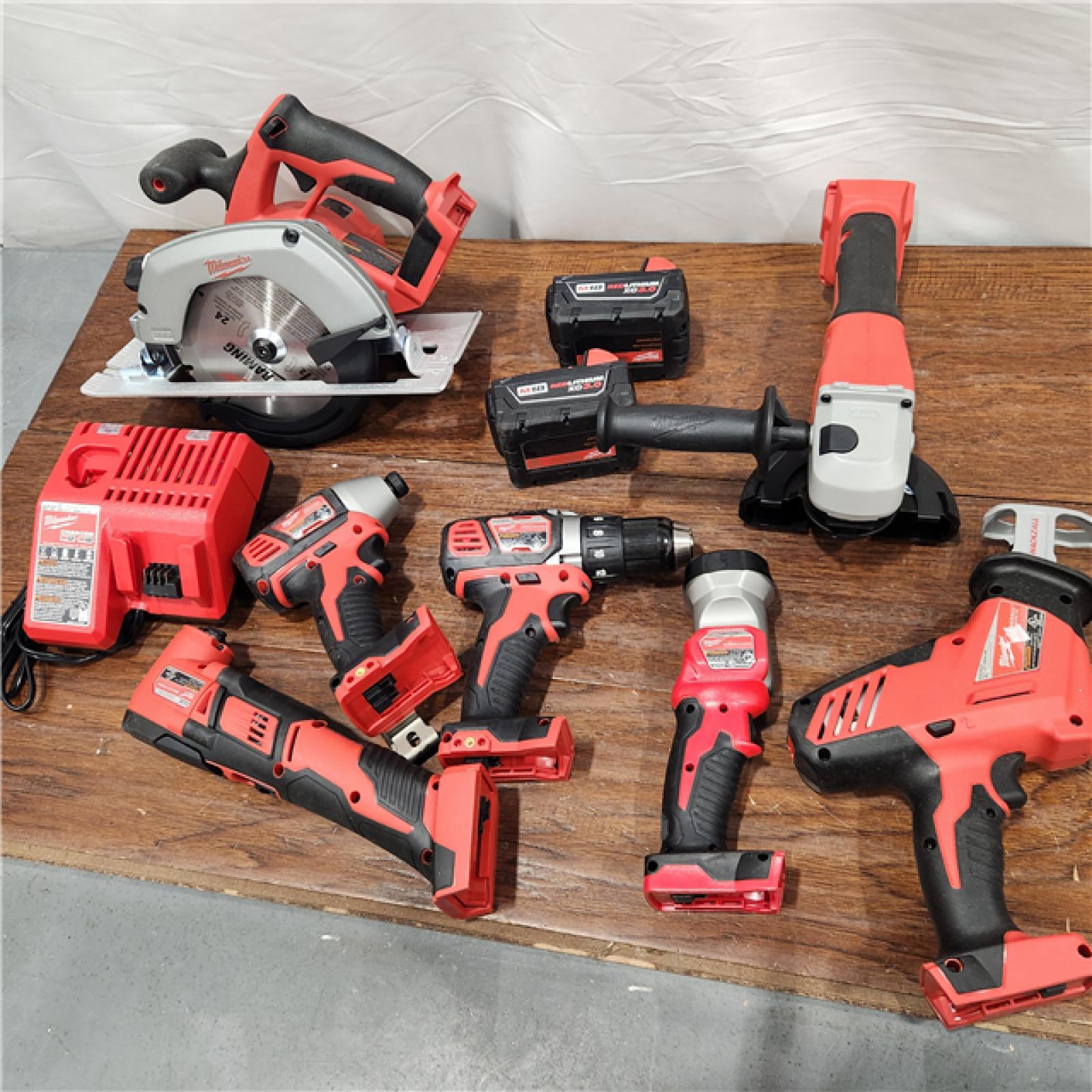 AS-IS Milwaukee M18 18-Volt Lithium-Ion Cordless Combo Kit 7-Tool with 2-Batteries, Charger and Tool Bag