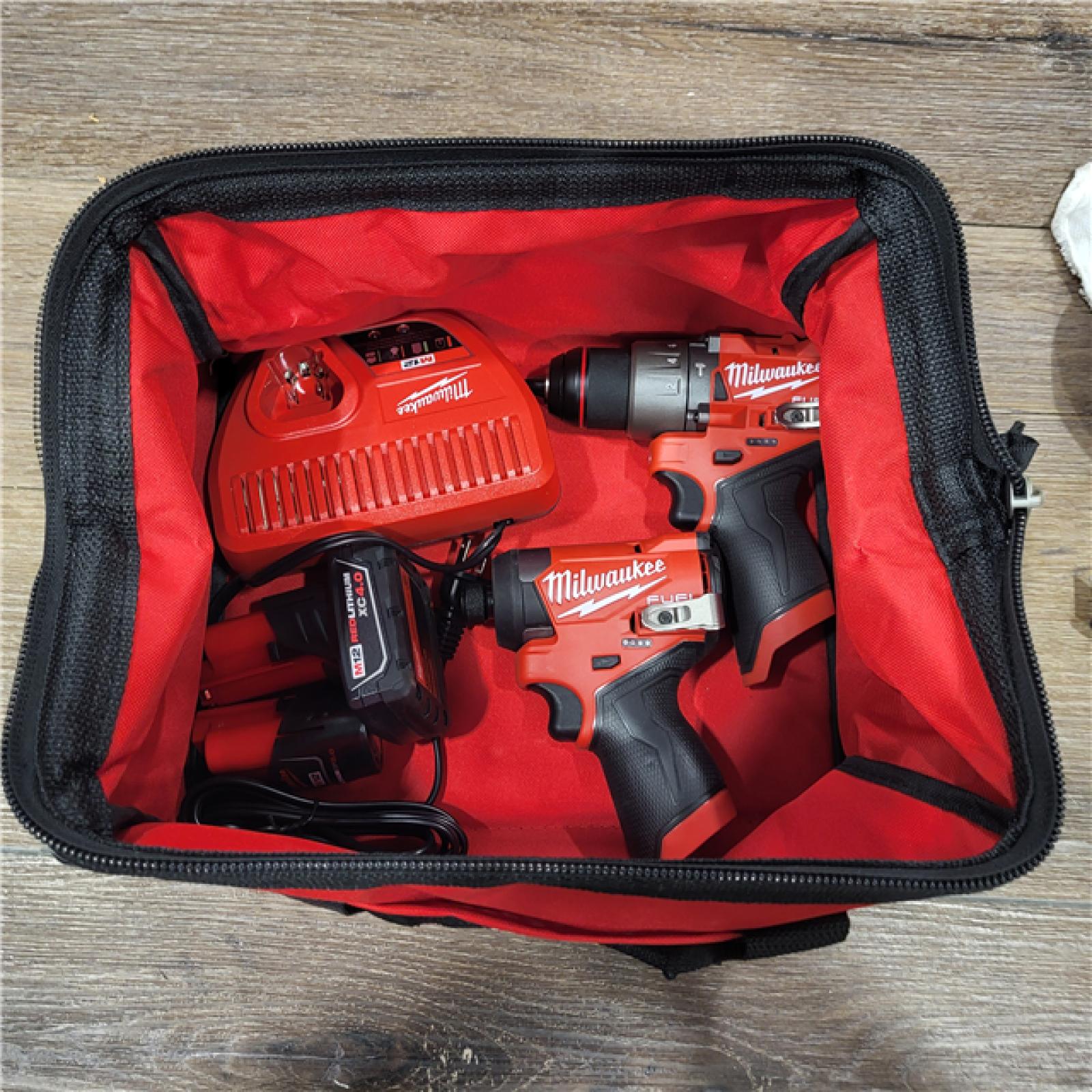 AS-IS M18 18-Volt Lithium-Ion Brushless Cordless Combo Kit (4-Tool) with 2-Batteries, 1-Charger and Tool Bag