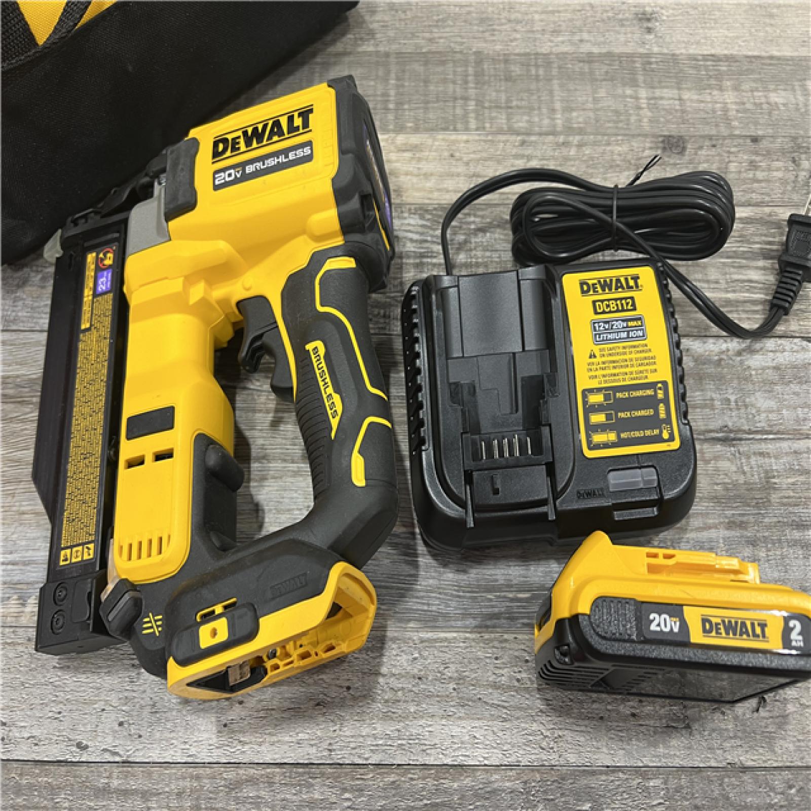 AS-IS DEWALT ATOMIC 20V MAX Lithium Ion Cordless 23 Gauge Pin Nailer Kit with 2.0Ah Battery and Charger