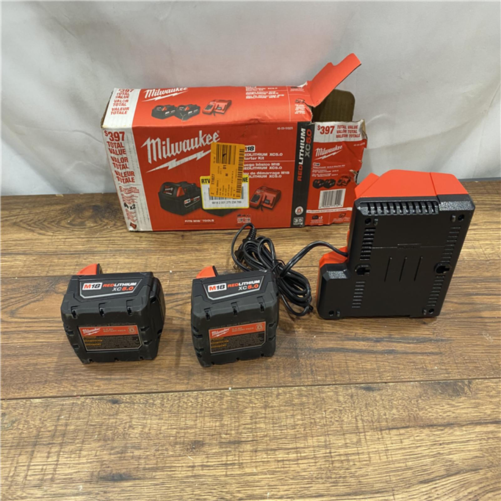 AS IS M18 18-Volt Lithium-Ion XC Starter Kit with Two 5.0Ah Batteries and Charger