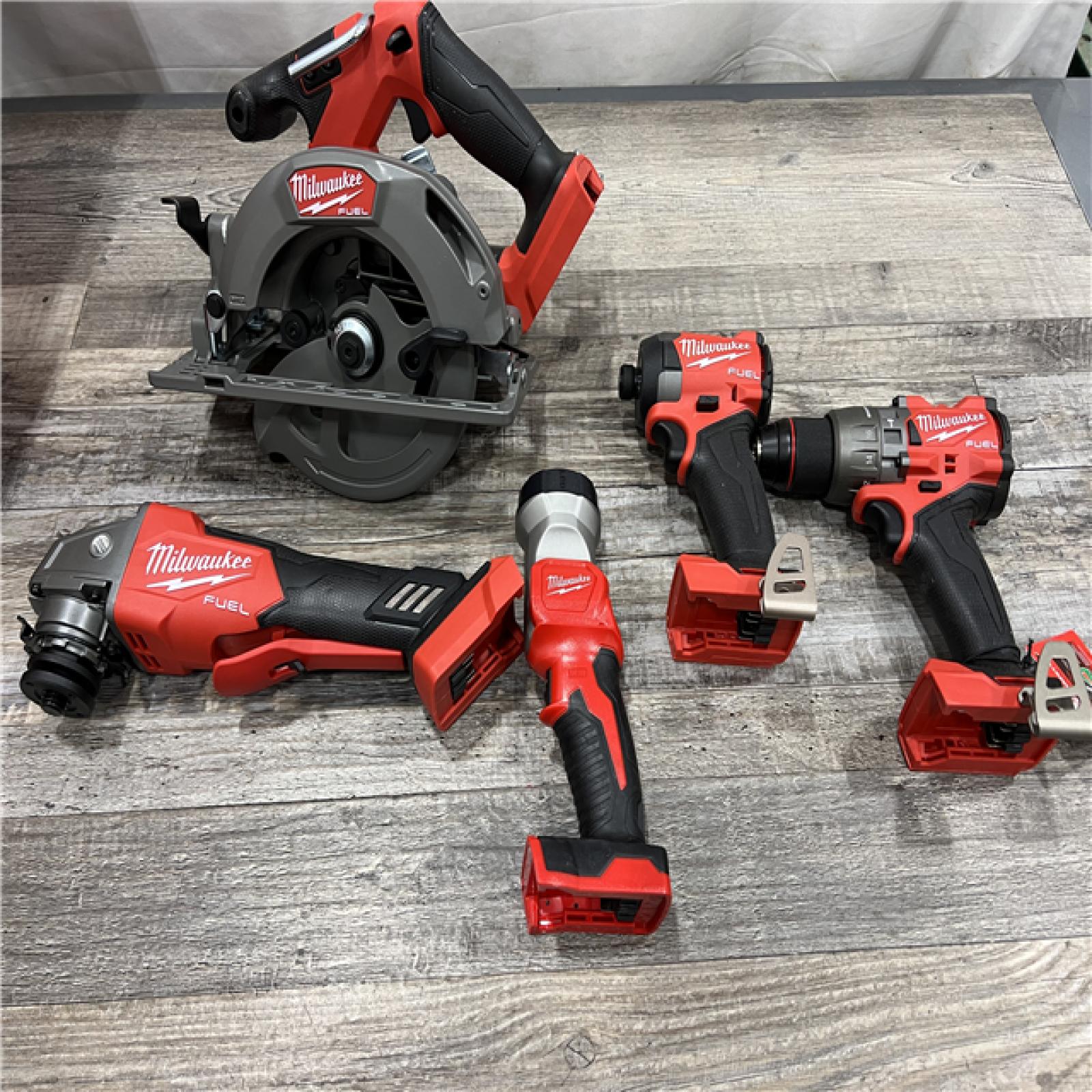 AS-IS MILWAUKEE M18 18-Volt Lithium-Ion Brushless Cordless FUEL Combo Kit (5-Tool) with 2-Batteries, 1-Charger, and Tool Bag