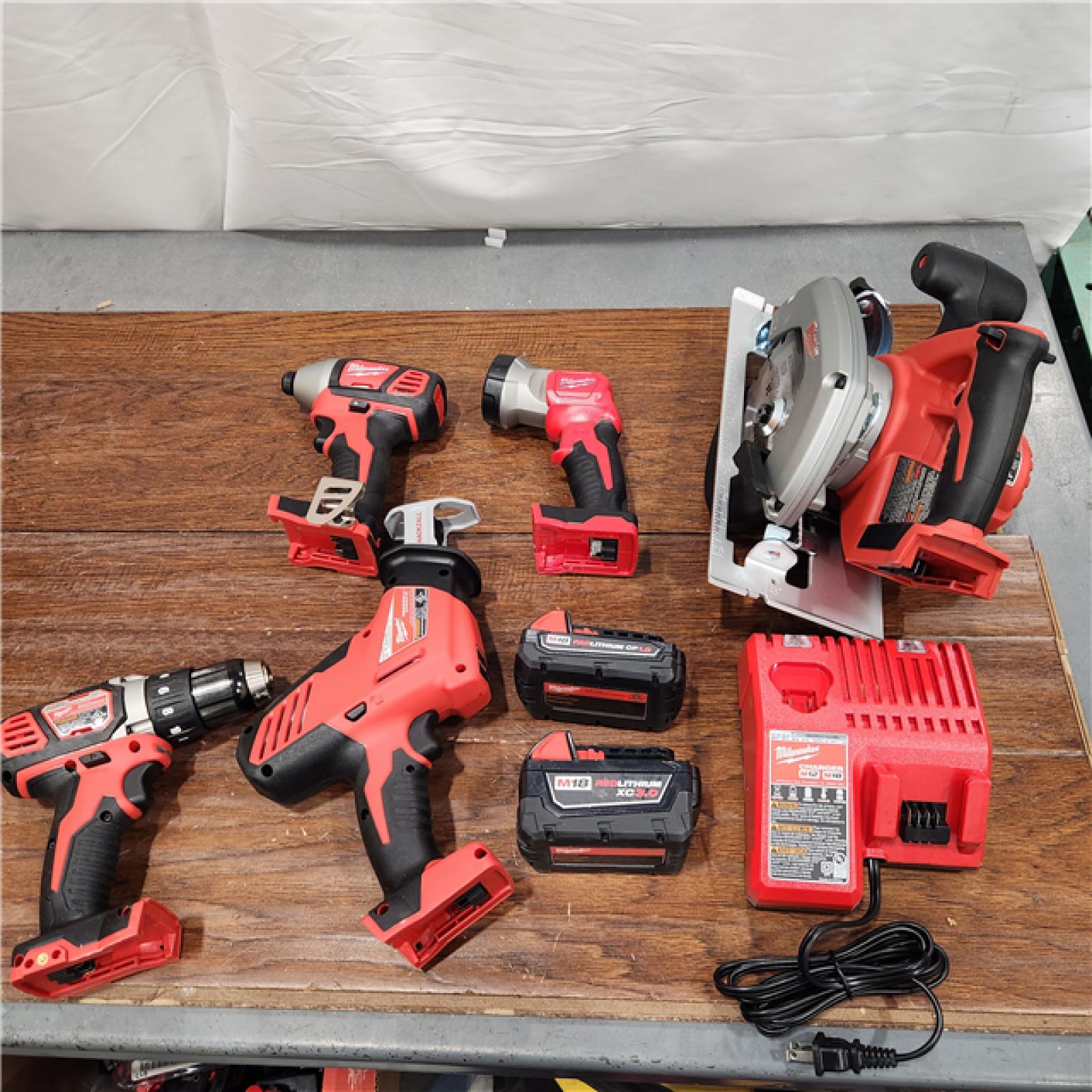 AS-IS Milwaukee M18 18-Volt Lithium-Ion Cordless Combo Tool Kit (5-Tool) with (1) 3.0Ah and (1) 1.5Ah Battery, (1) Charger, (1) Tool Bag