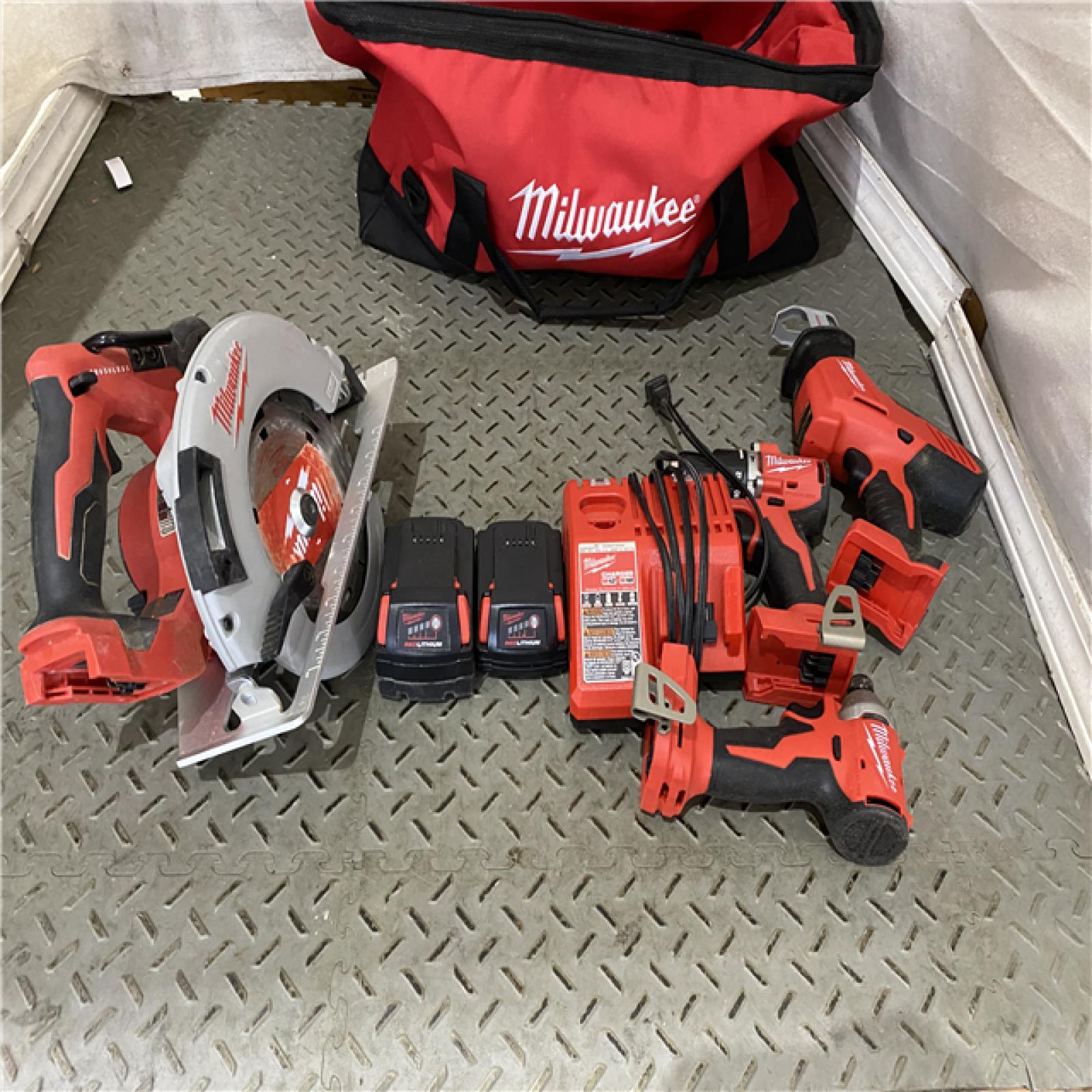 Houston location AS-IS M18 18-Volt Lithium-Ion Brushless Cordless Combo Kit (4-Tool) with 2-Batteries, 1-Charger and Tool Bag