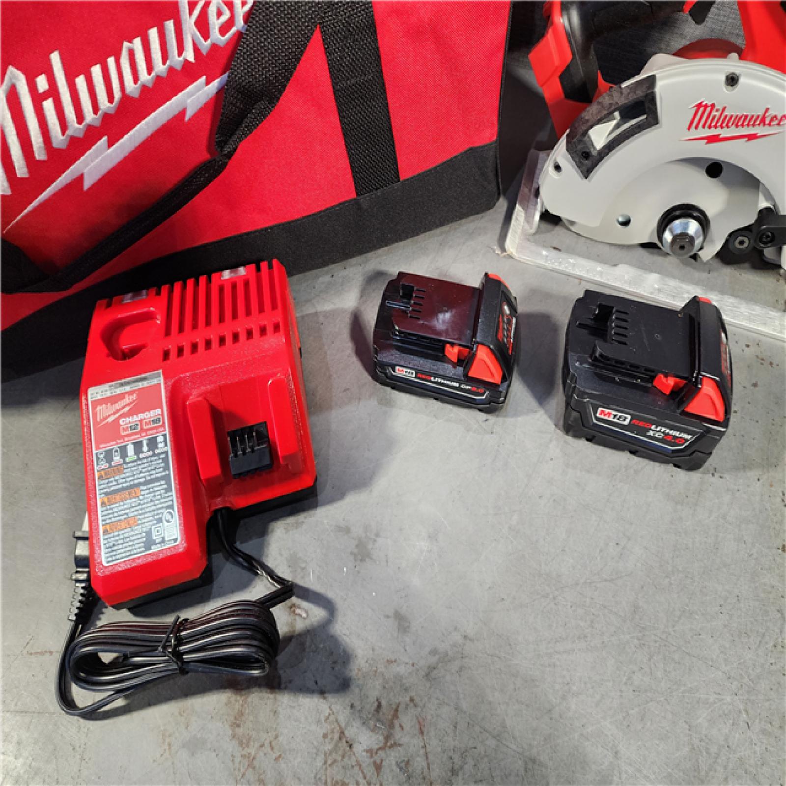 HOUSTON LOCATION - AS-IS (APPEARS LIKE NEW) Milwaukee M18 18-Volt Lithium-Ion Brushless Cordless Combo Kit (4-Tool) with 2-Batteries, 1-Charger and Tool Bag