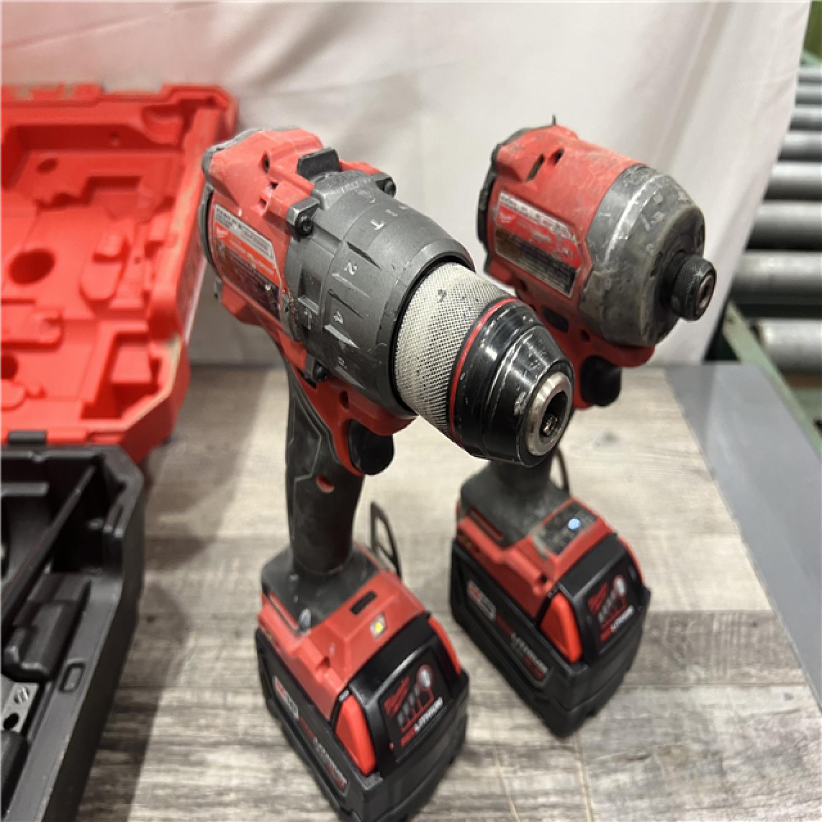 AS-IS MILWAUKEE M18 FUEL 18V Lithium-Ion Brushless Cordless Hammer Drill and Impact Driver Combo Kit (2-Tool) with 2 Batteries