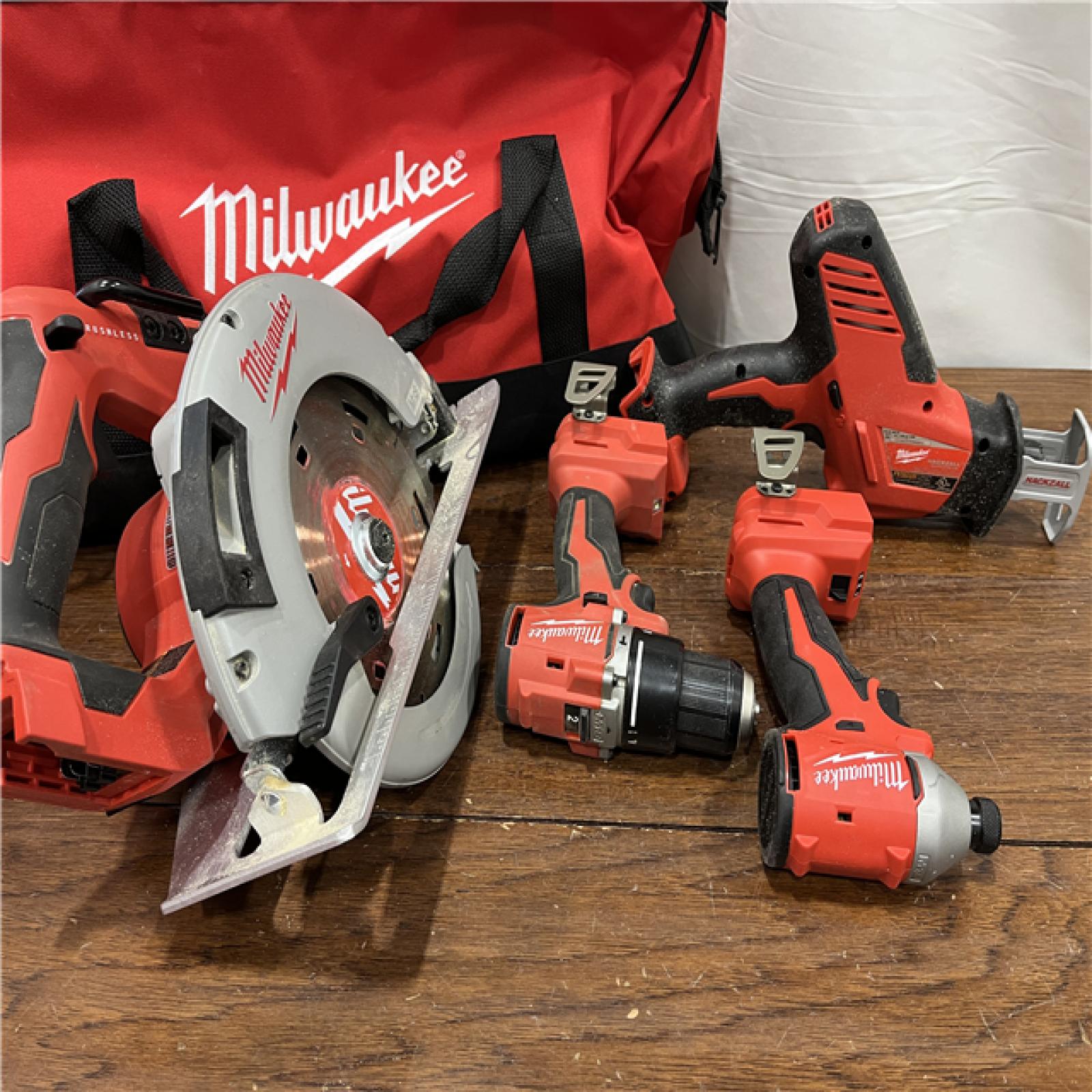 AS-ISMilwaukee M18 18-Volt Lithium-Ion Brushless Cordless Combo Kit (4-Tool) with 2-Batteries, 1-Charger and Tool Bag